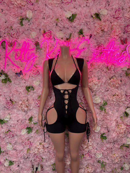 Black one-piece bodysuit with halter neckline, lace-up cutouts and garter straps