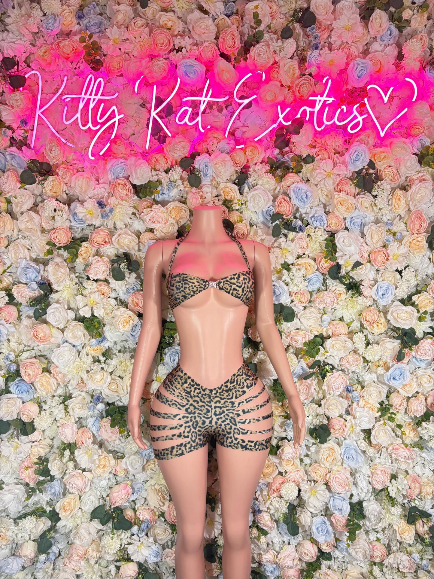 Leopard-print rave bodysuit with front cutout and crisscross straps