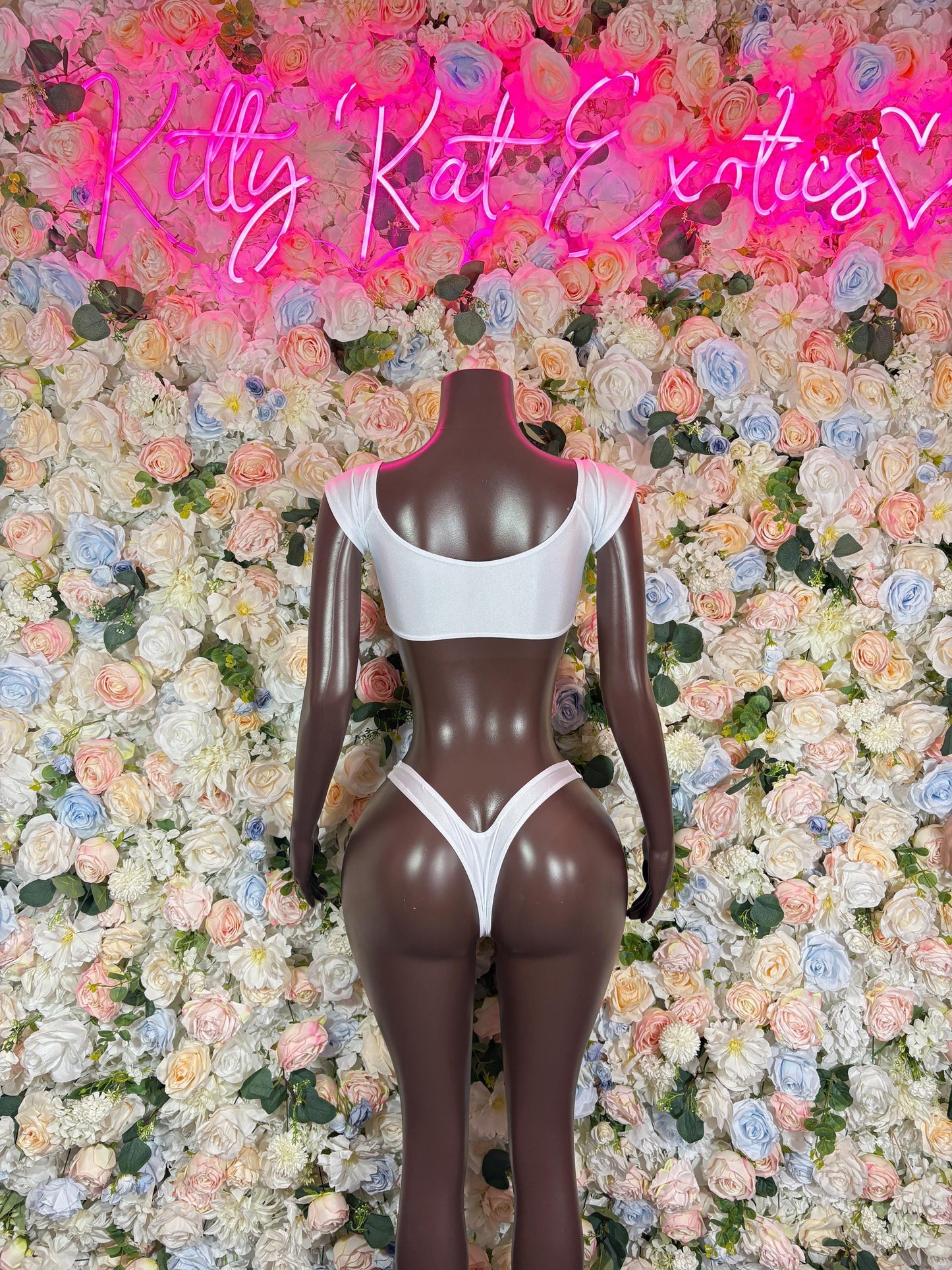 White strappy two-piece dancewear set with open-back triangle bra and thong bottoms