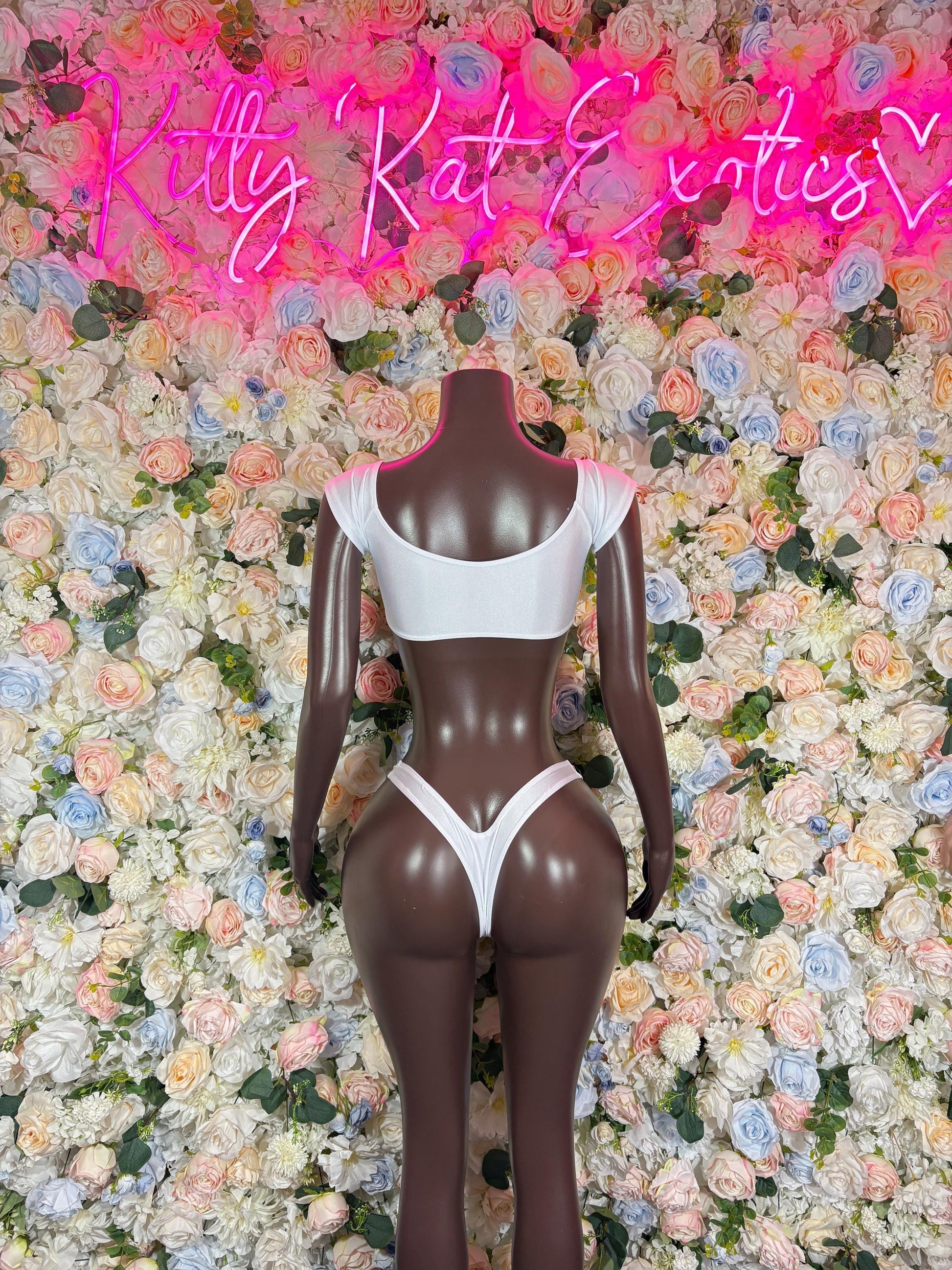 White strappy two-piece dancewear set with open-back triangle bra and thong bottoms