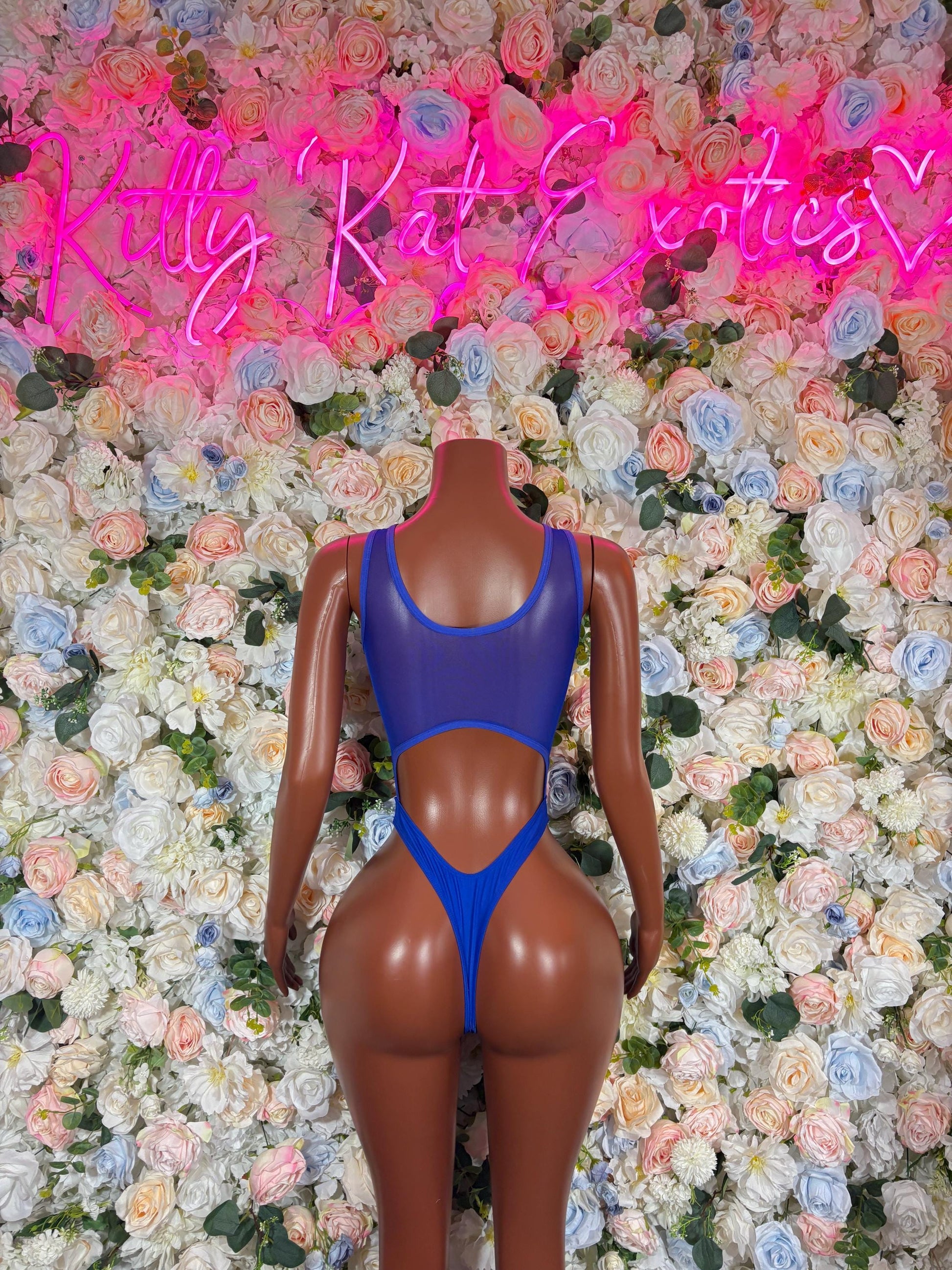 Blue one-piece bodysuit with open back and high-cut leg openings