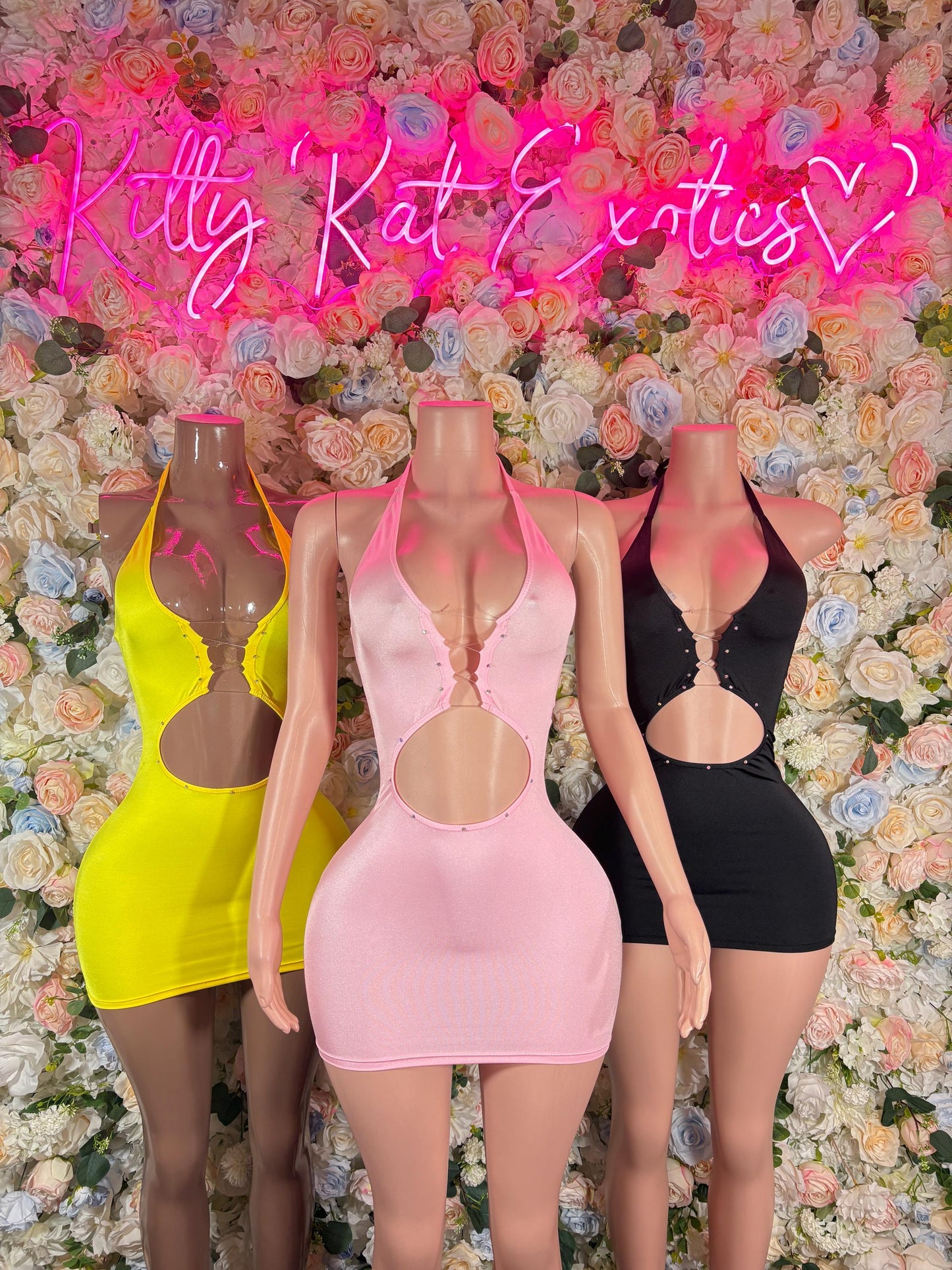 Set of three mini dresses in yellow, pink, and black halter styles