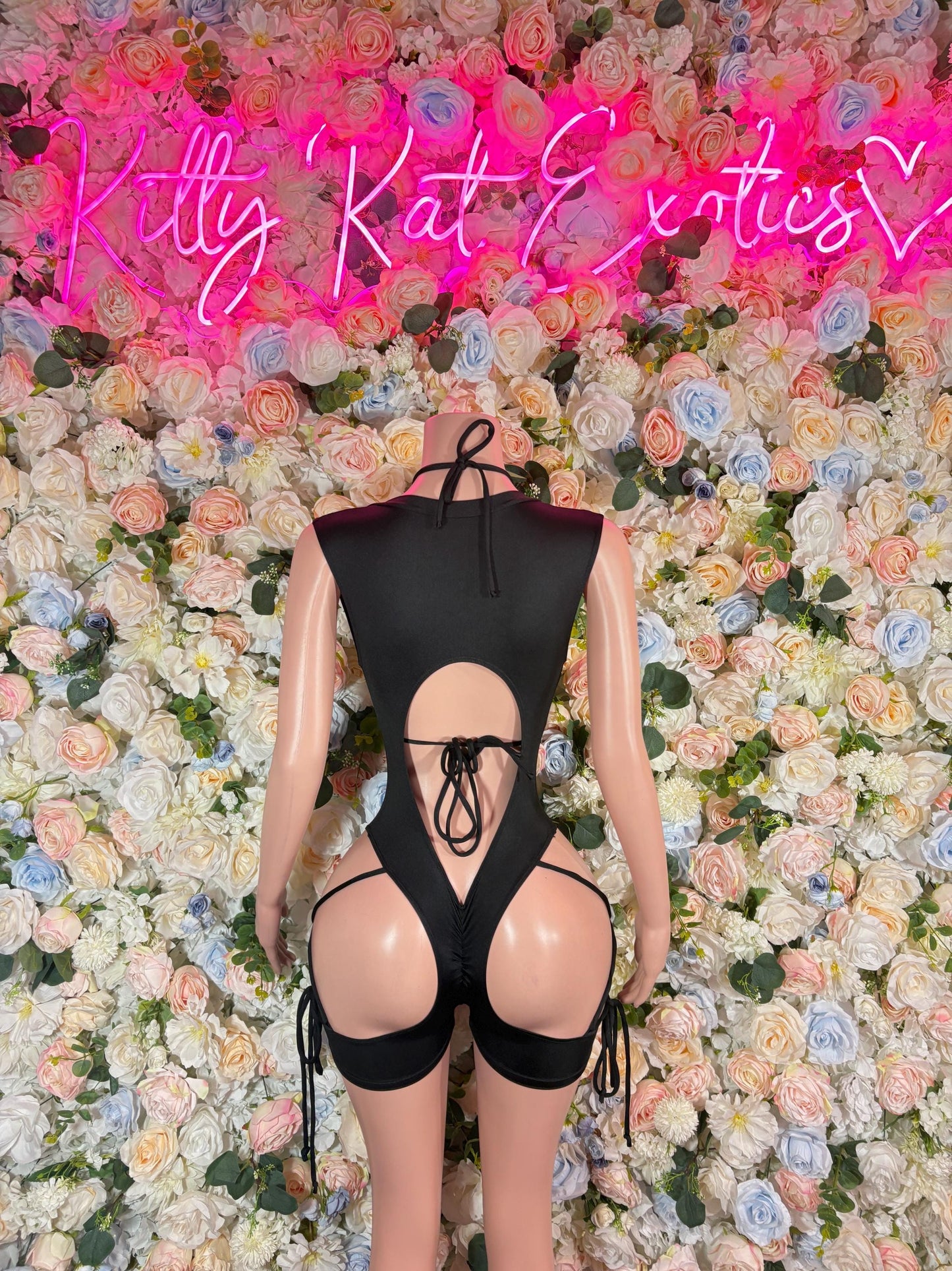 Black cutout lace-up backless bodysuit with crisscross front lacing and ties