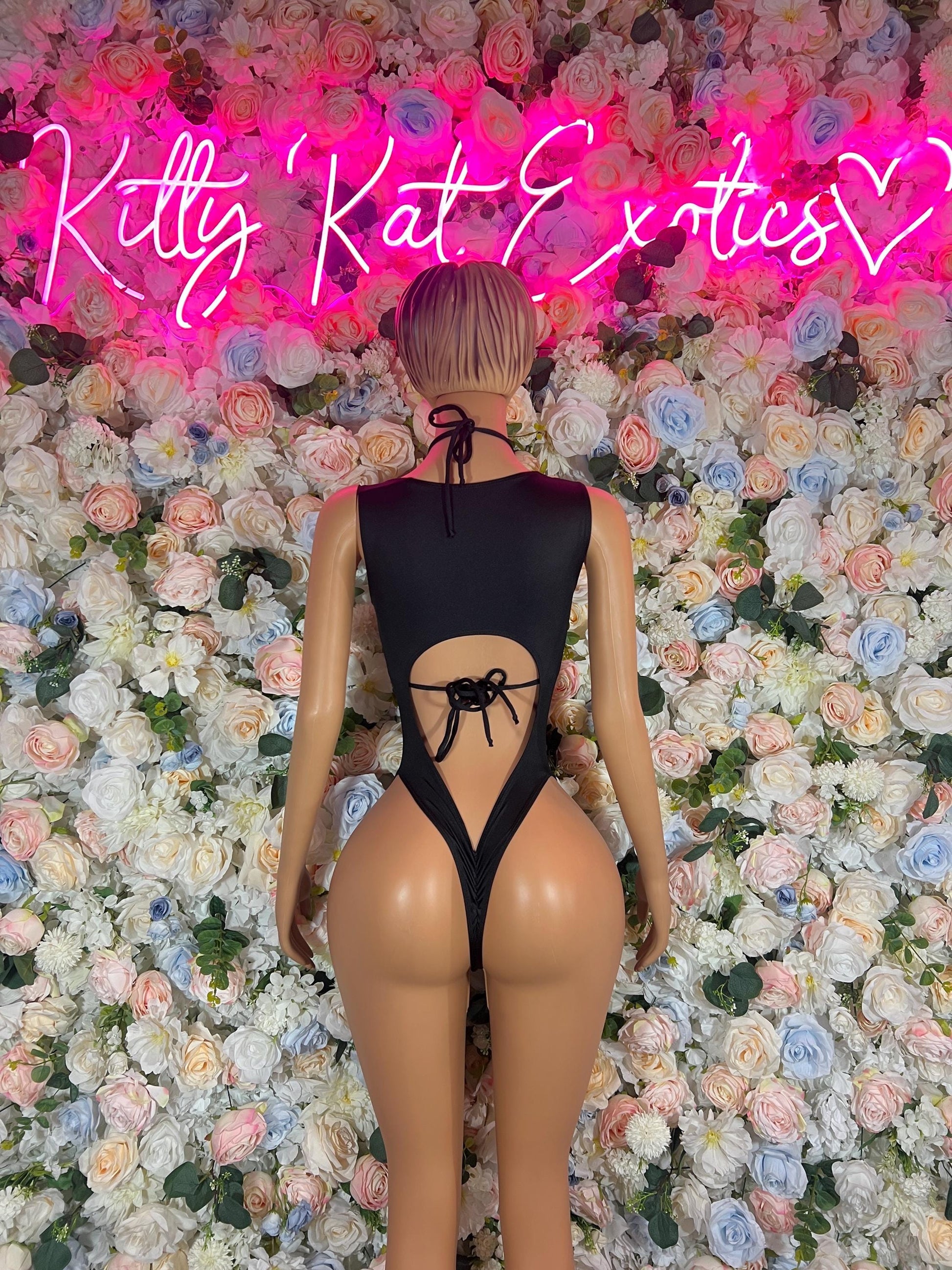 Black lace-up open-back bodysuit with crisscross tie straps