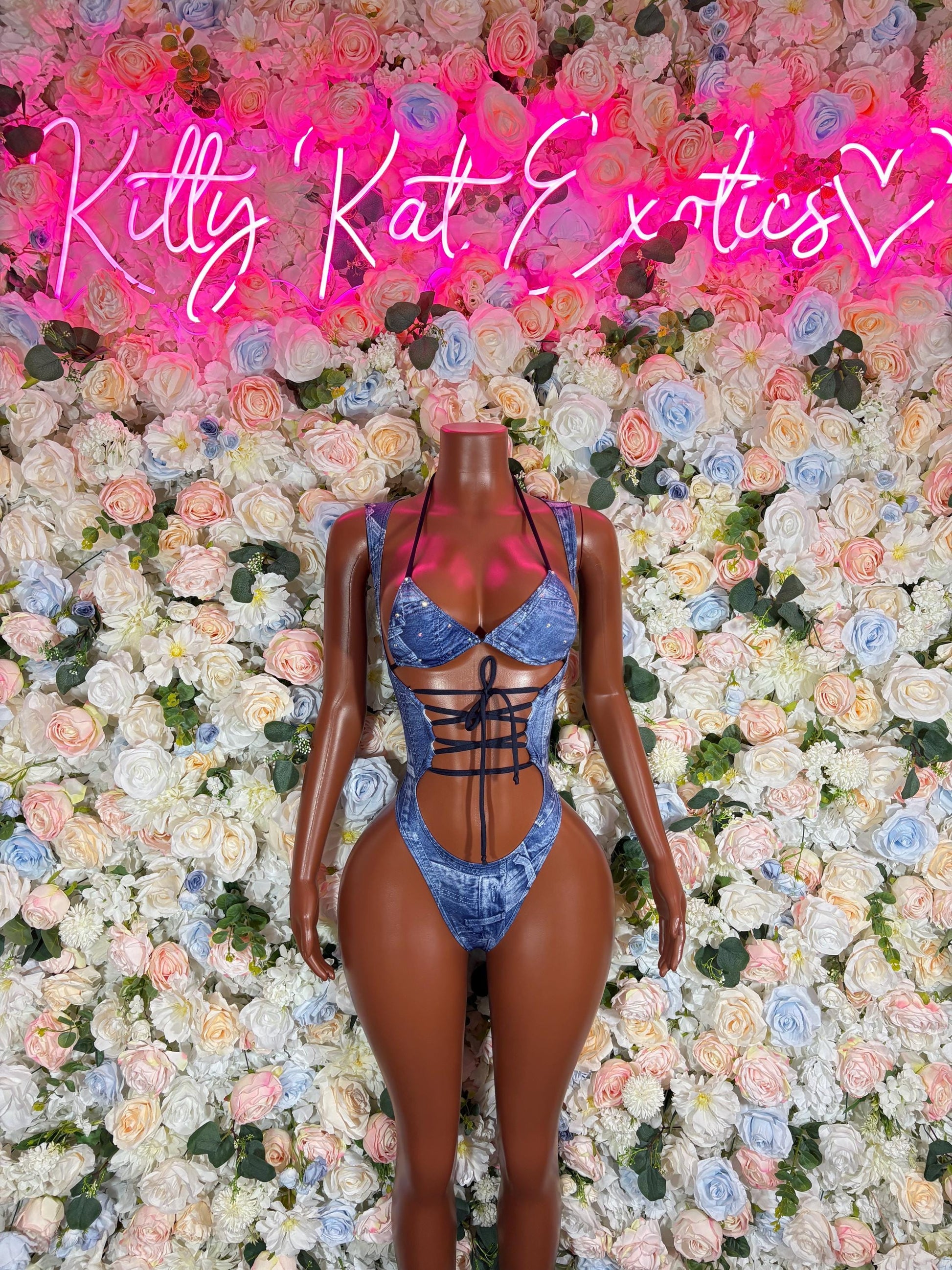 Blue denim-print halter bodysuit with strappy cutouts and lace-up front