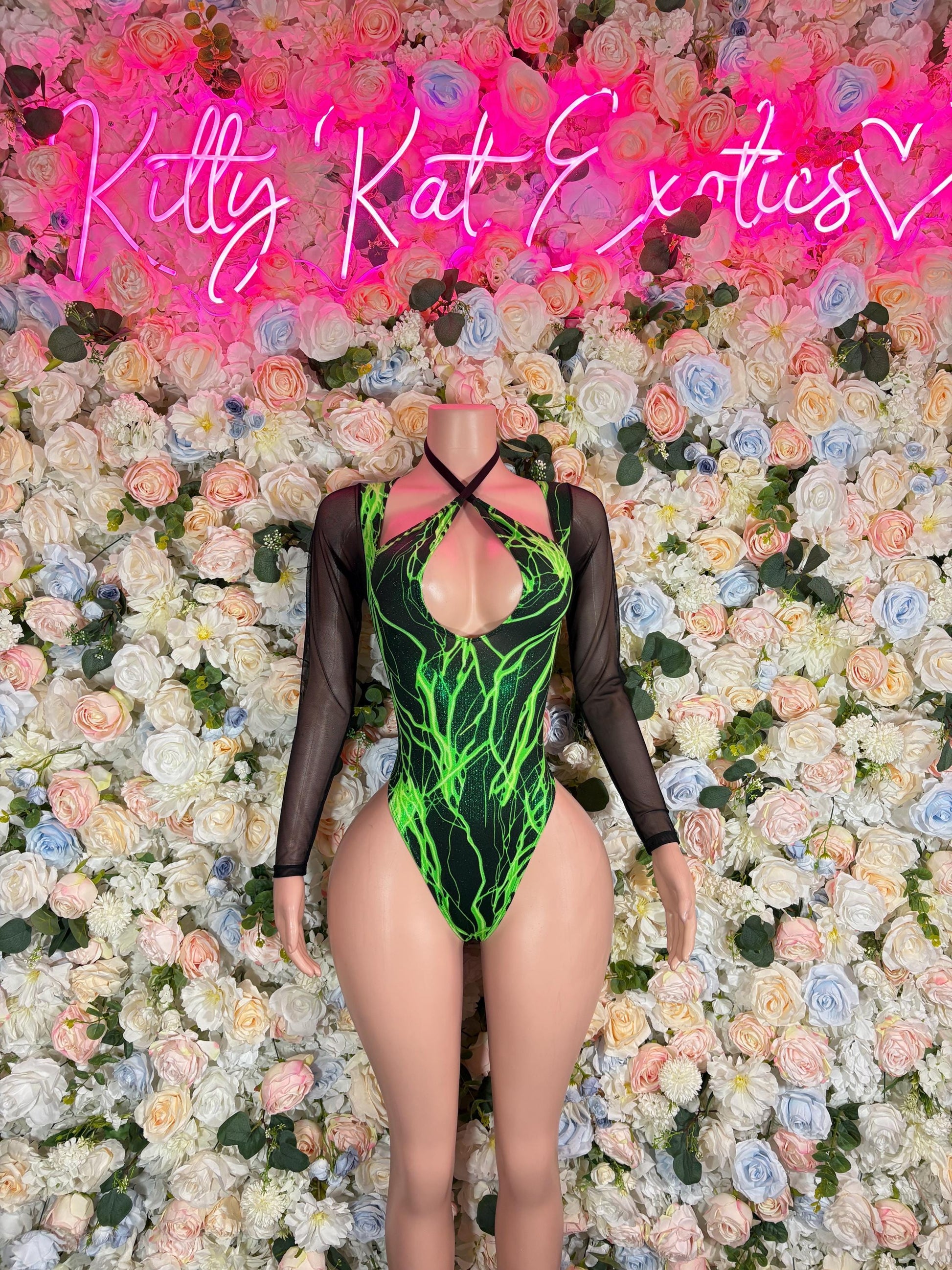 Black long-sleeve one-piece bodysuit with neon green electric graphic and V neckline