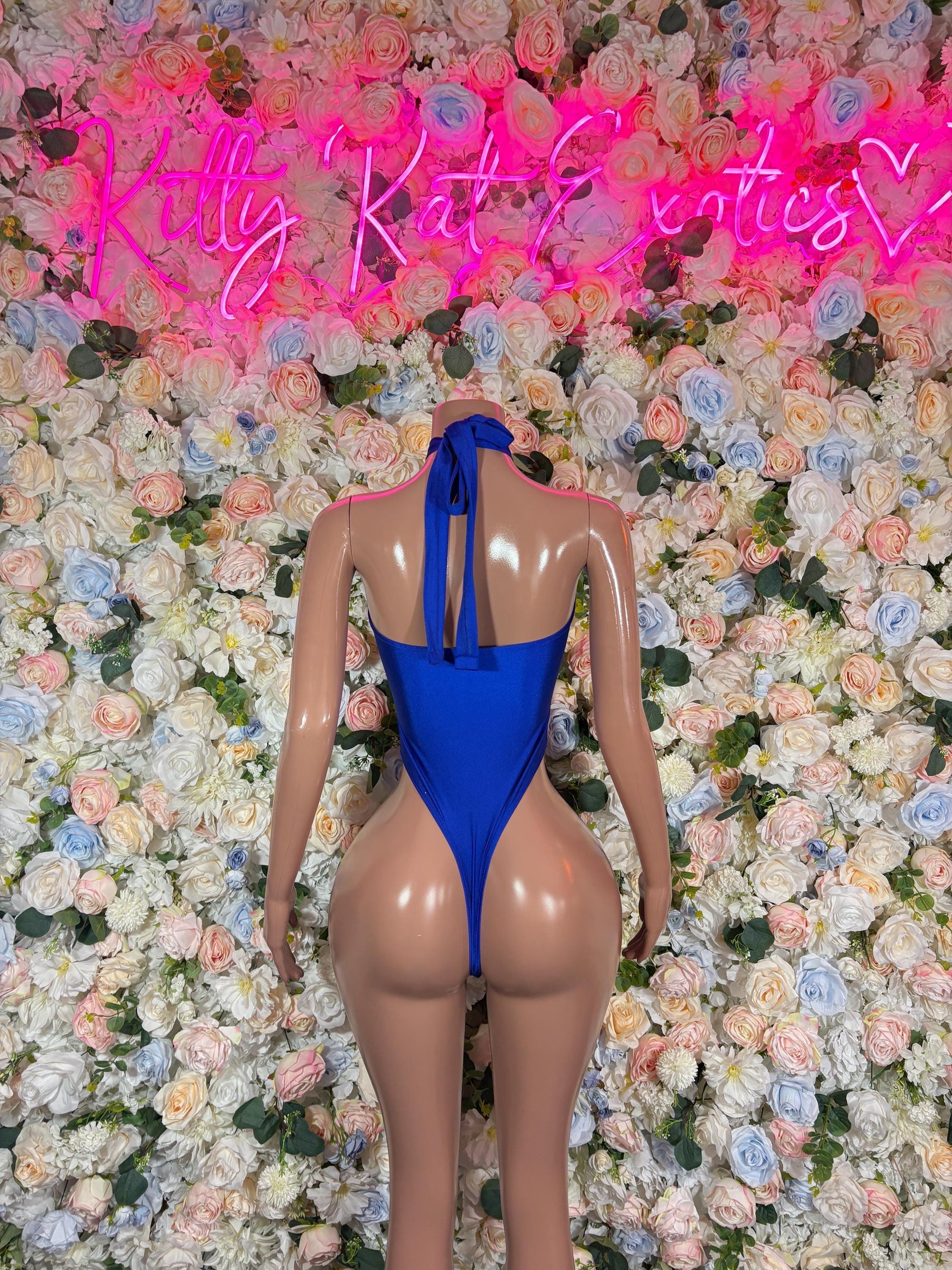 Blue one-piece bodysuit with open back and halter straps