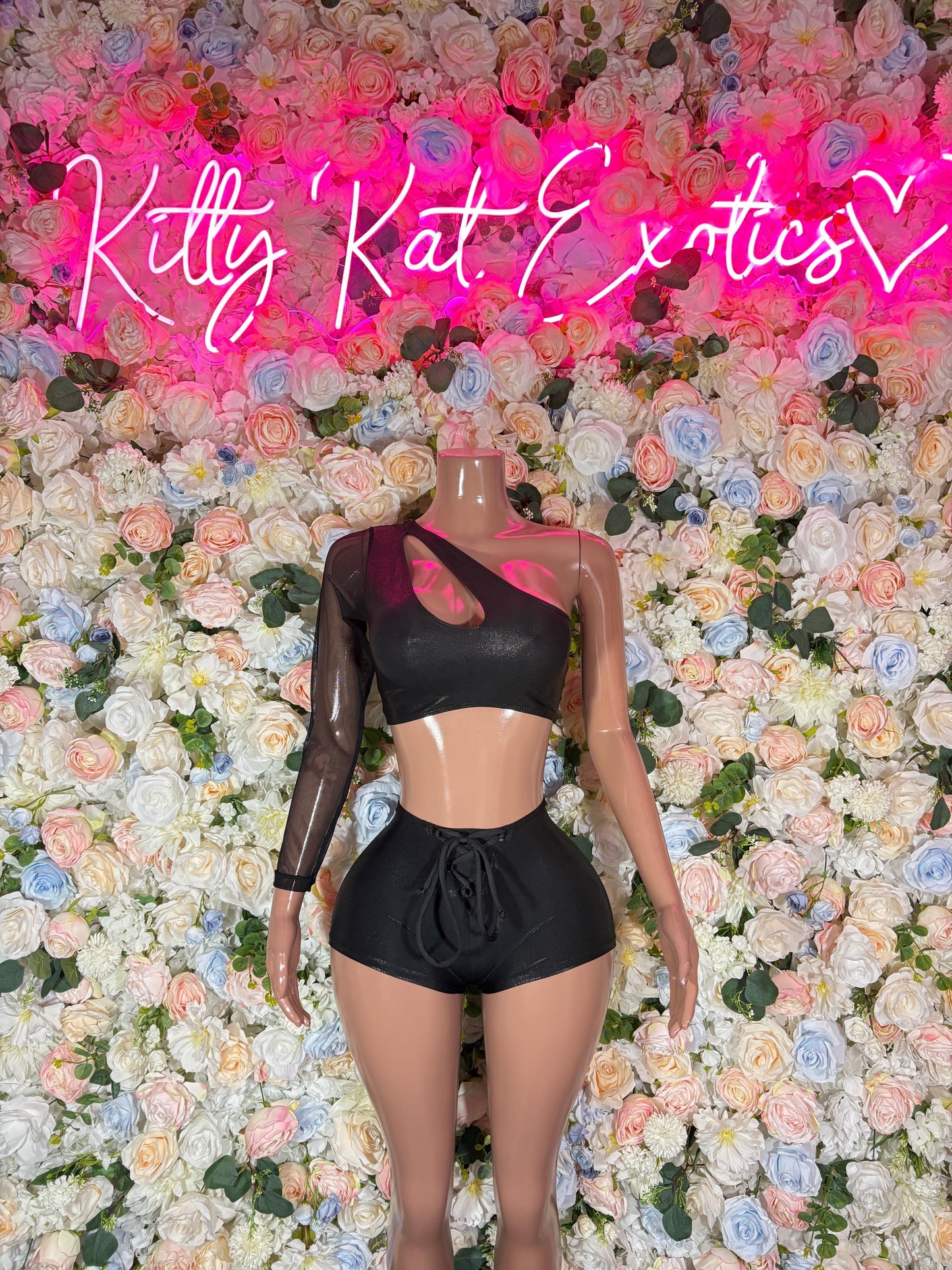 Black long-sleeve cropped top and high-waist short set with mesh neckline