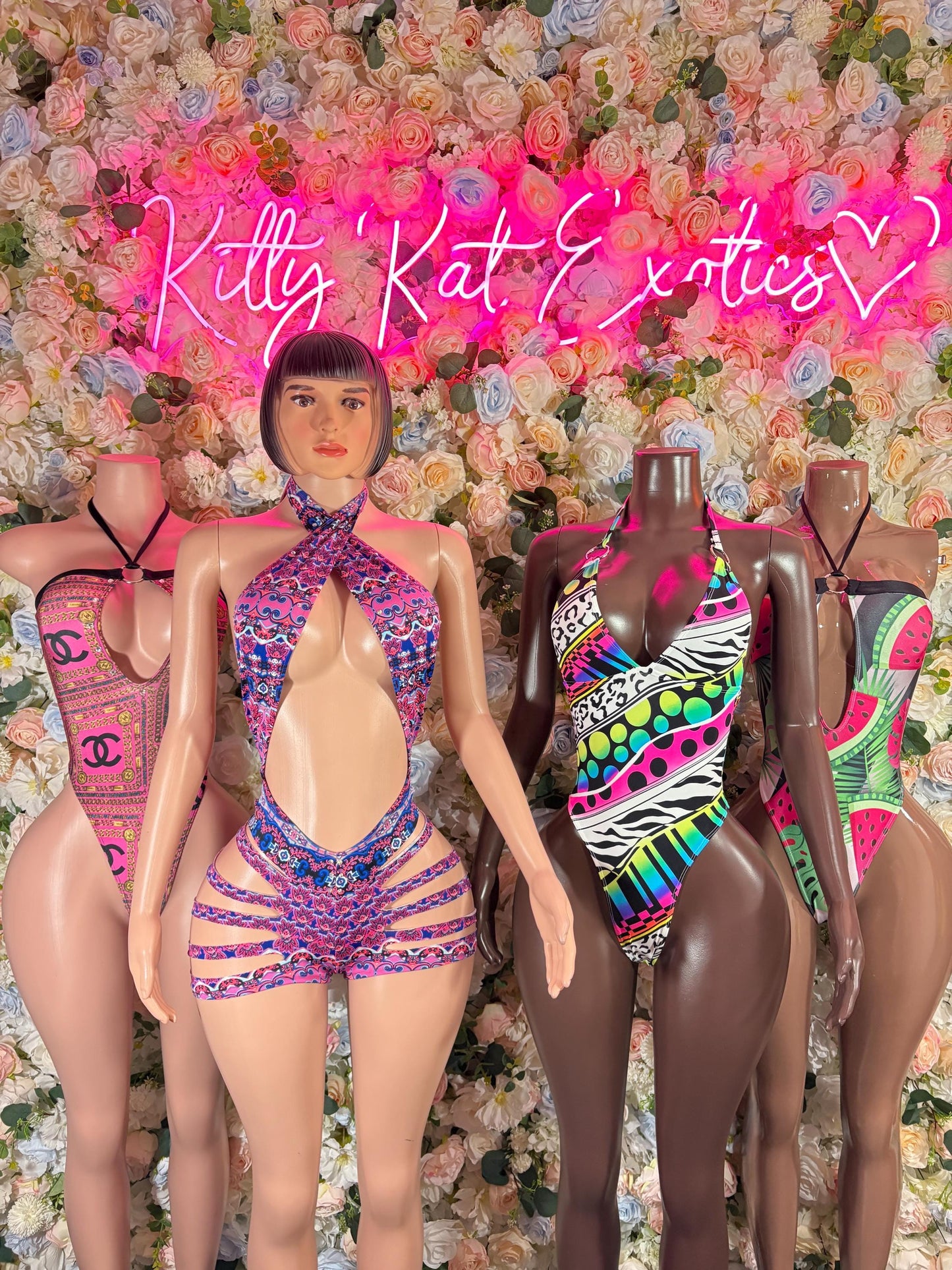 Multicolor one-piece bodysuit with geometric rainbow print and halter bow