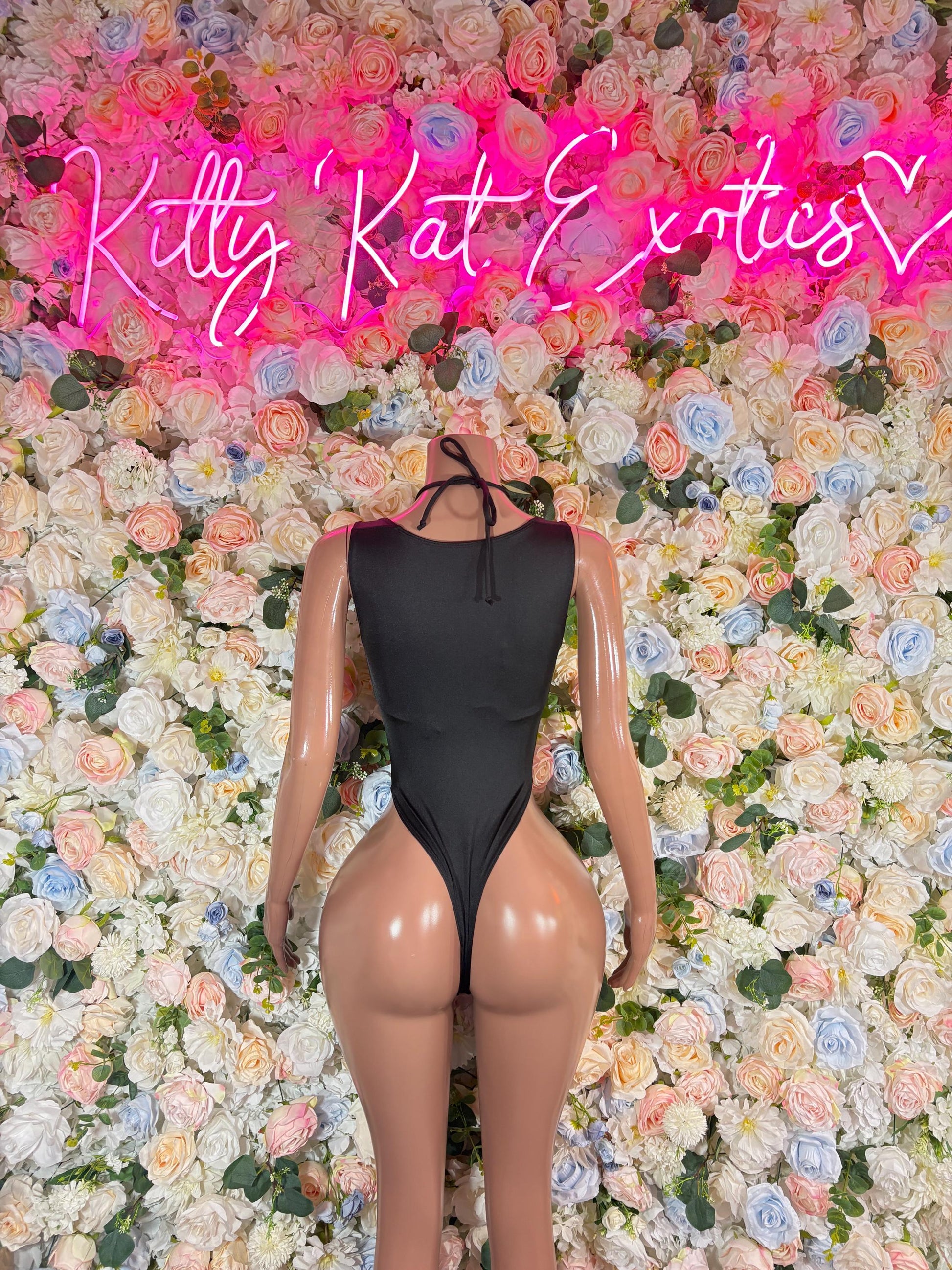 Black halter bodysuit with lace-up neckline and thong-style bottom