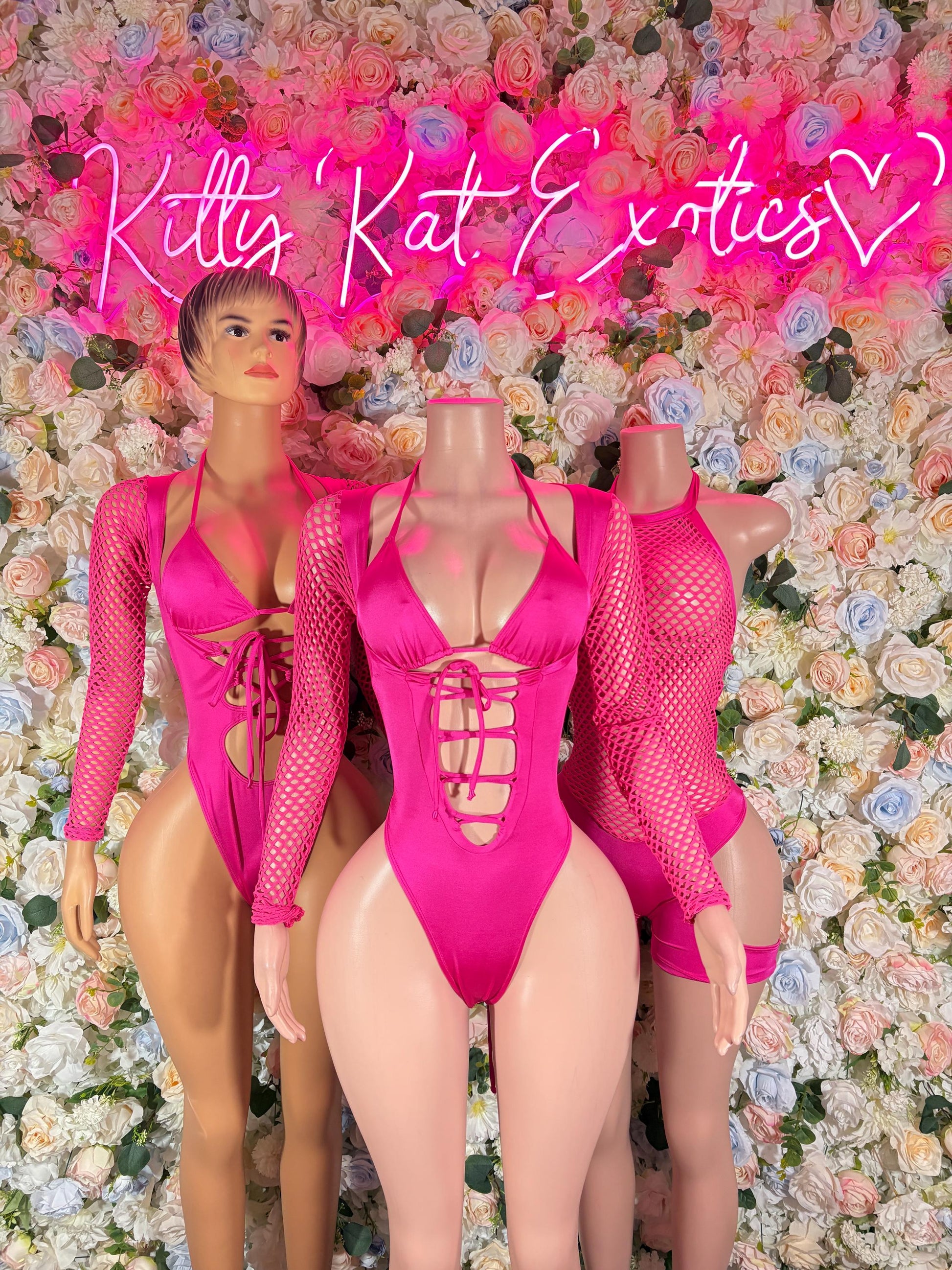 Pink mesh long-sleeve bodysuit with front cutout and lace-up neckline detail