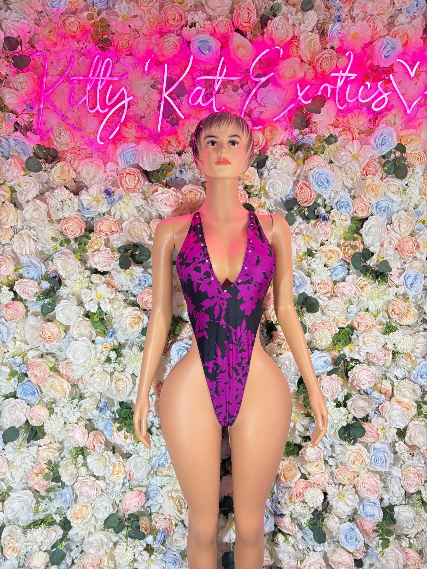 Purple and black one-piece halter bodysuit with deep V neckline