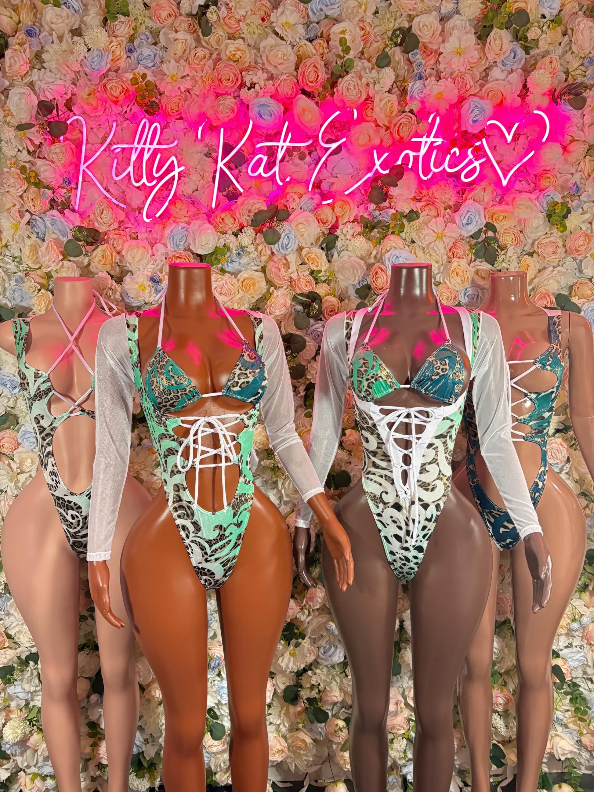 Aqua leopard-print bodysuits with strappy front and white sleeve accents