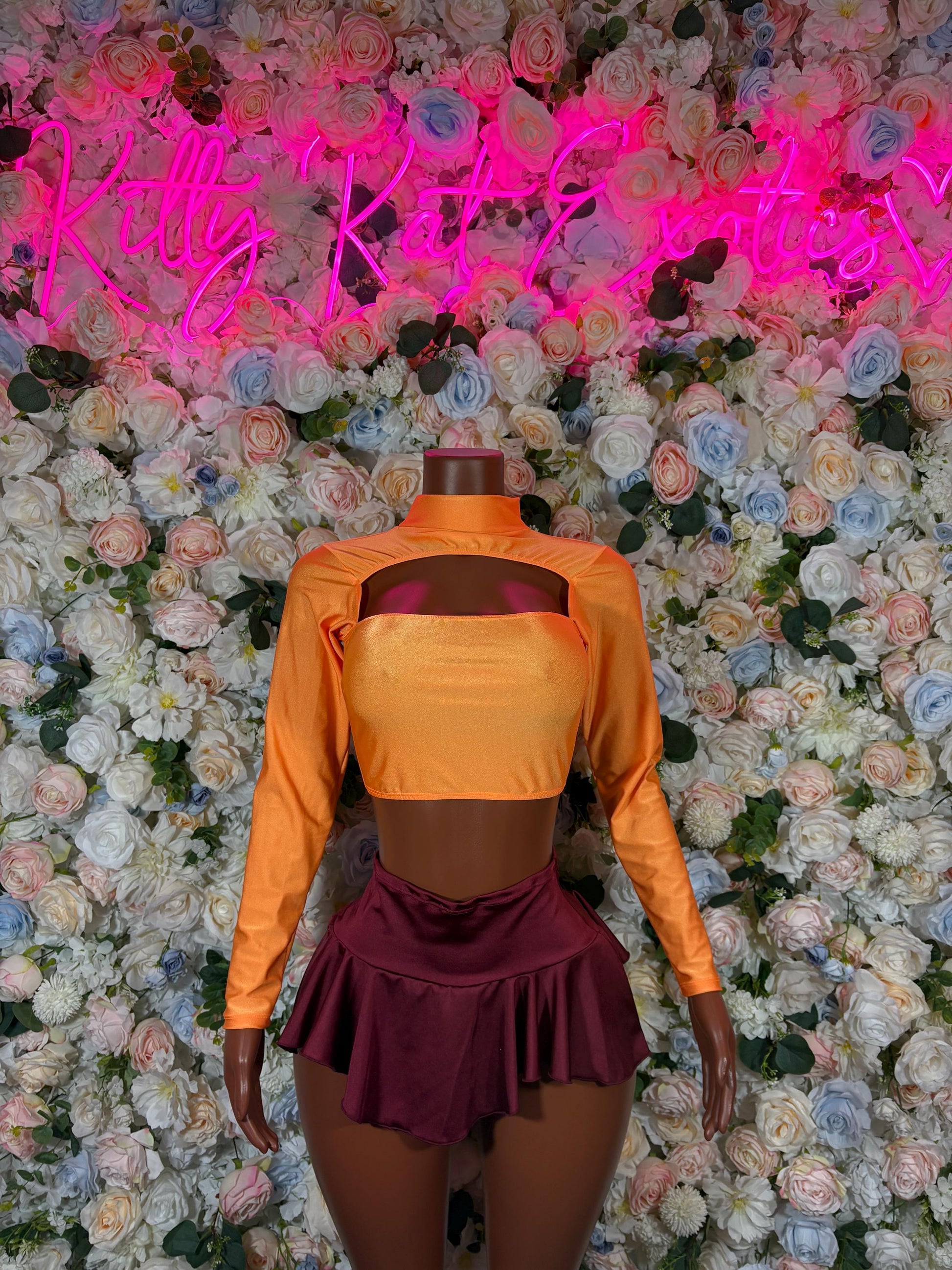 Women’s cartoon-style costume: orange long-sleeve turtleneck top with burgundy skirt