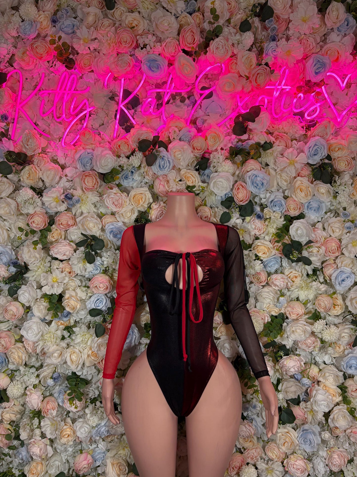 Black and red long-sleeve bodysuit with lace-up front and deep V back cutout