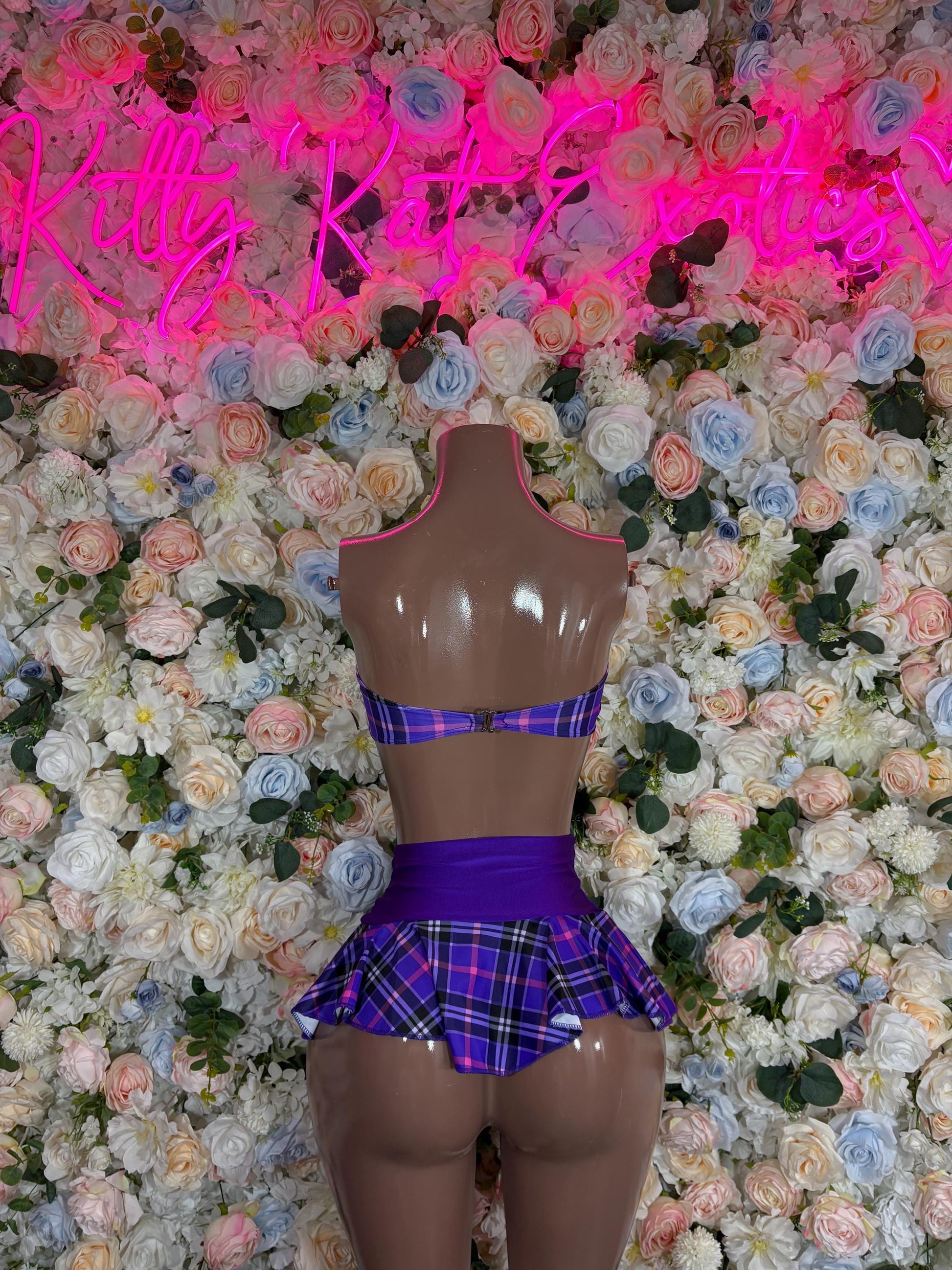 Purple plaid two-piece skirt set with cropped top and pleated mini skirt
