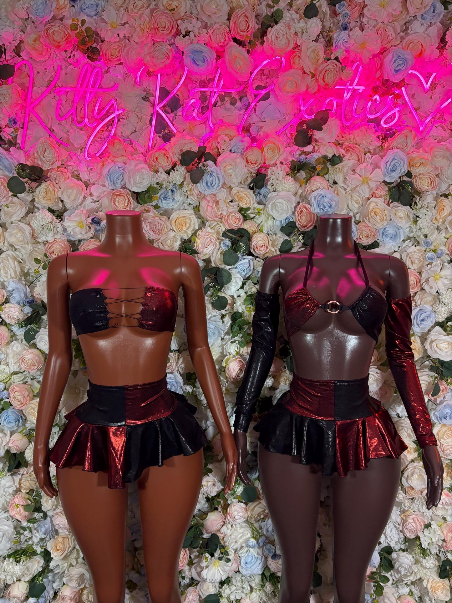 Two-piece black corset top and ruffled mini skirt costume set with red waist belt