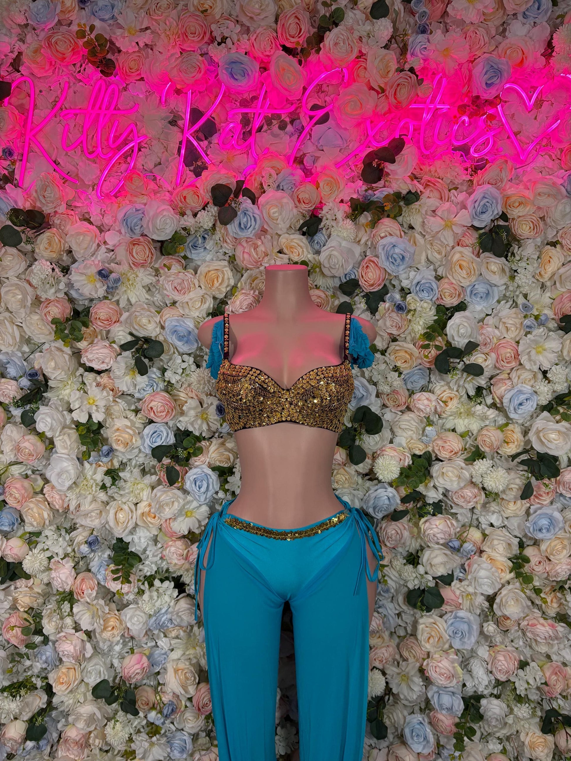 Women’s cosplay costume with gold sequin cropped top and teal fringe pants