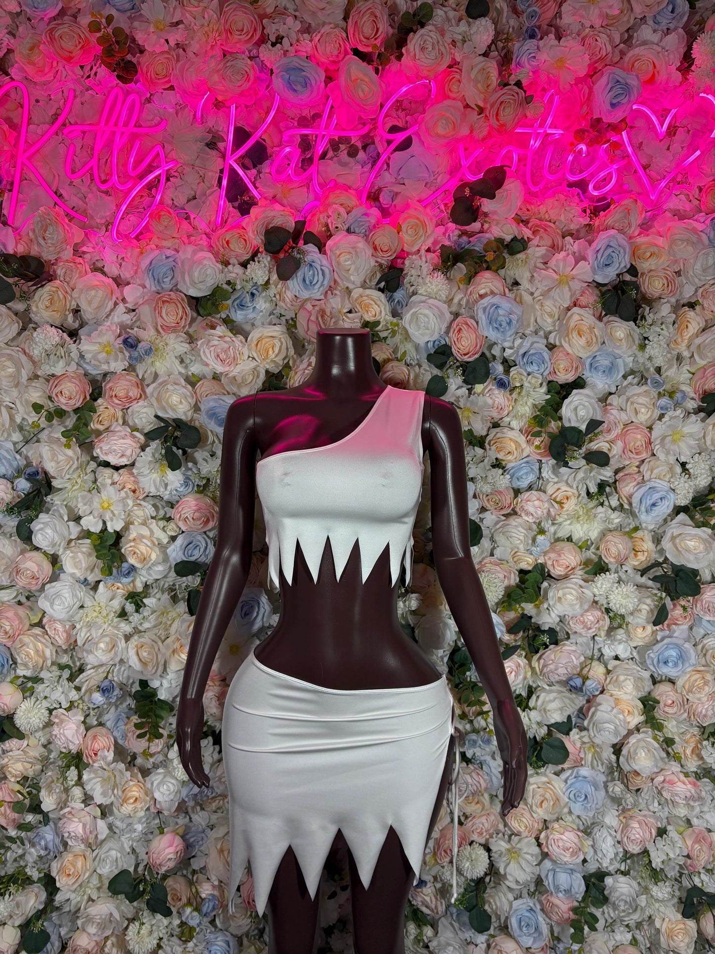 Halloween cosplay dress with dark bodice and white skirt, jagged pointed hem