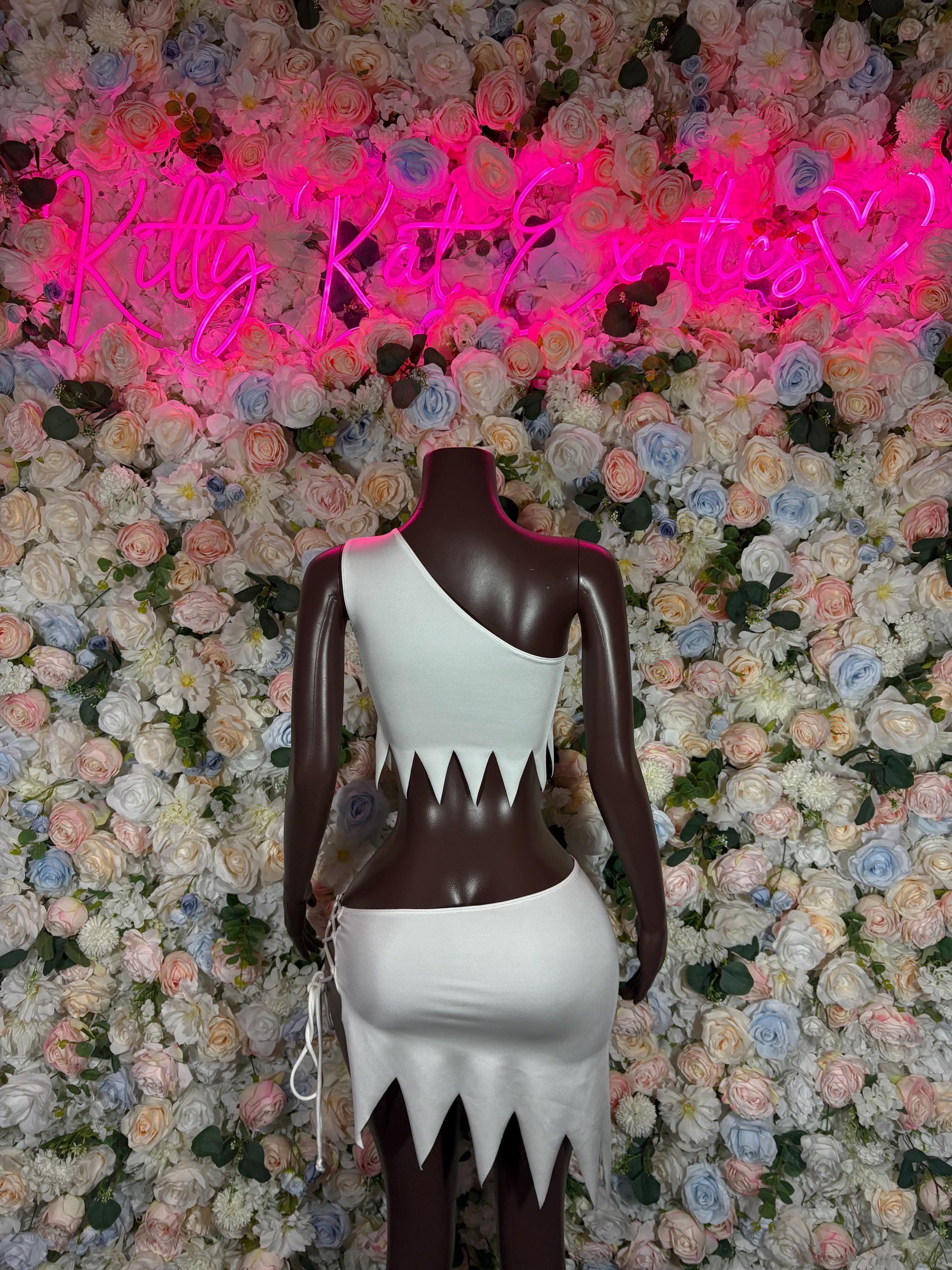 Halloween cosplay dress with dark cropped top and white layered skirt, pointed hem