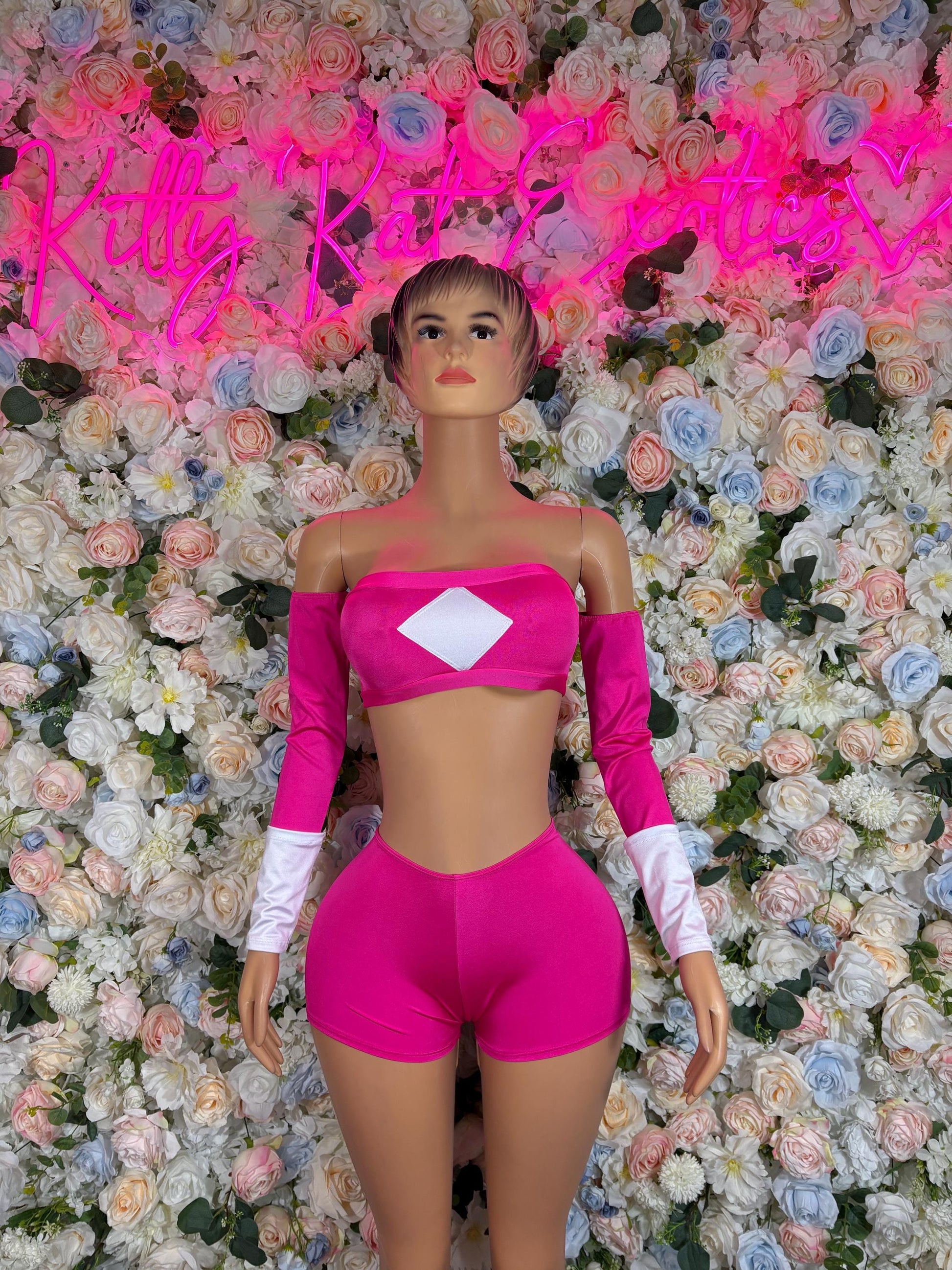 Pink bandeau crop top and high-waist shorts with white arm sleeves