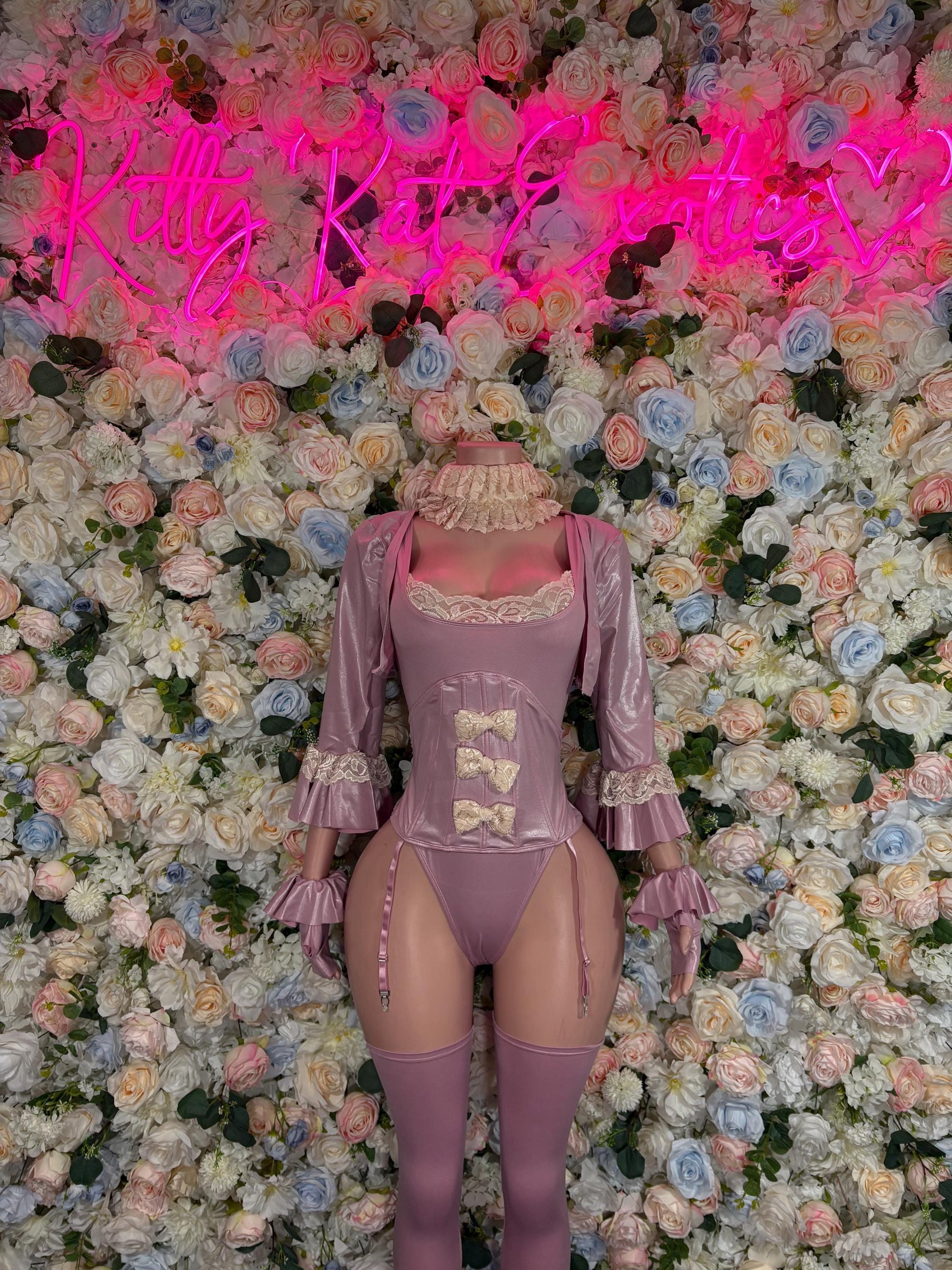 Women’s mauve ruffled bodysuit costume with lace panels and sleeve cuffs