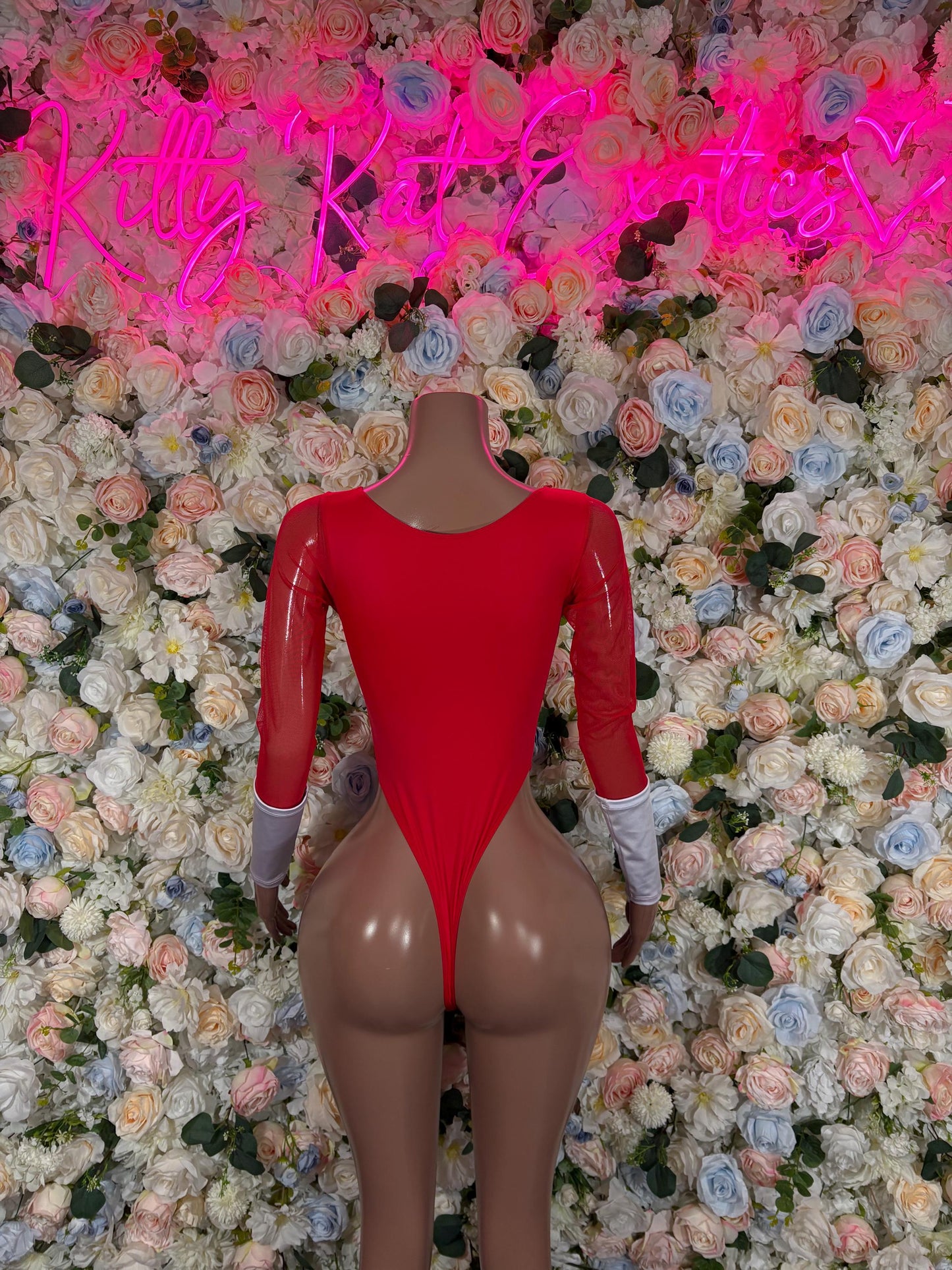 Red long-sleeve bodysuit with white diamond cutout front and high-cut legs