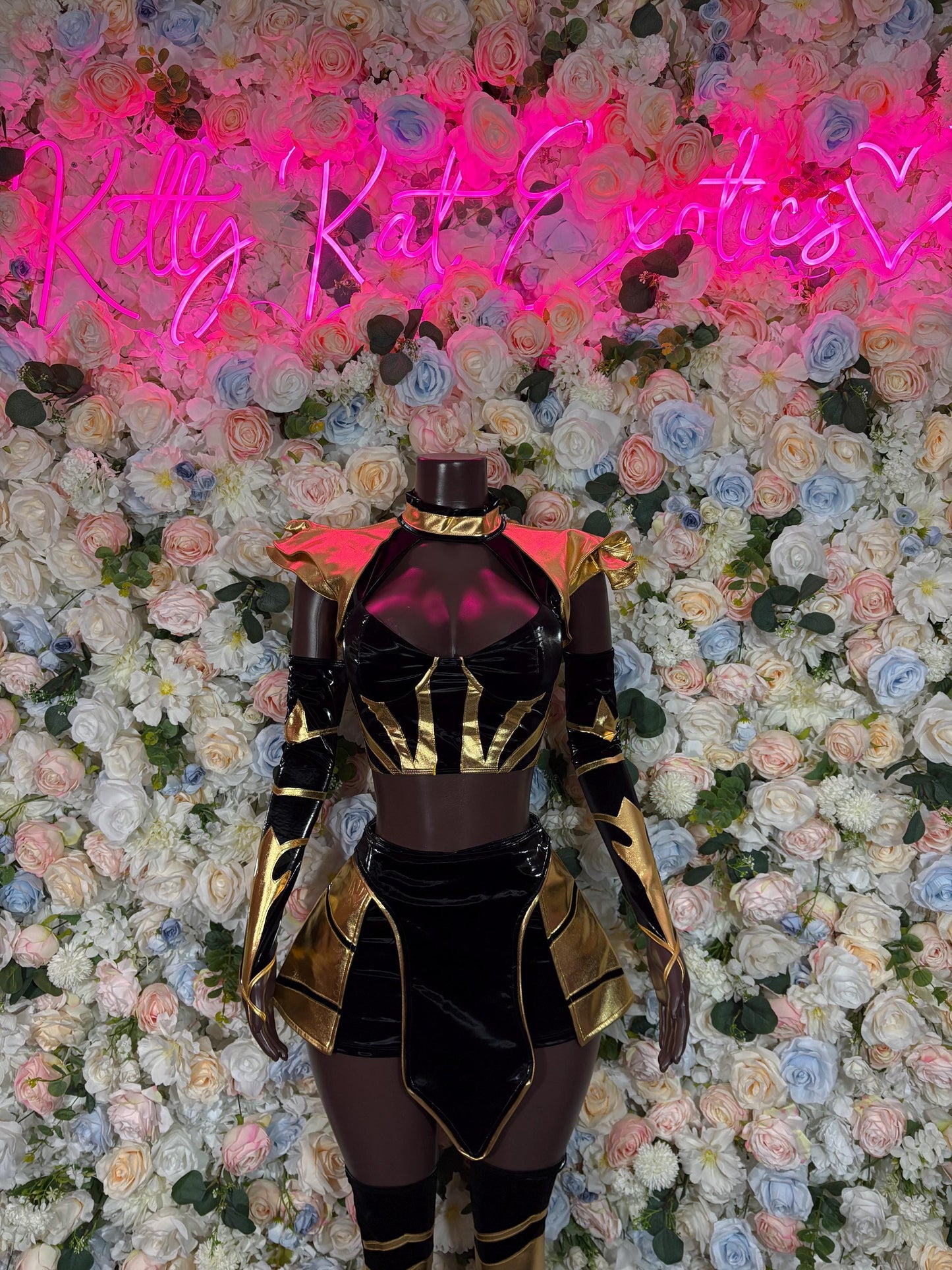 Women’s bottlegirl costume: black bodysuit with gold trim and shoulder pads