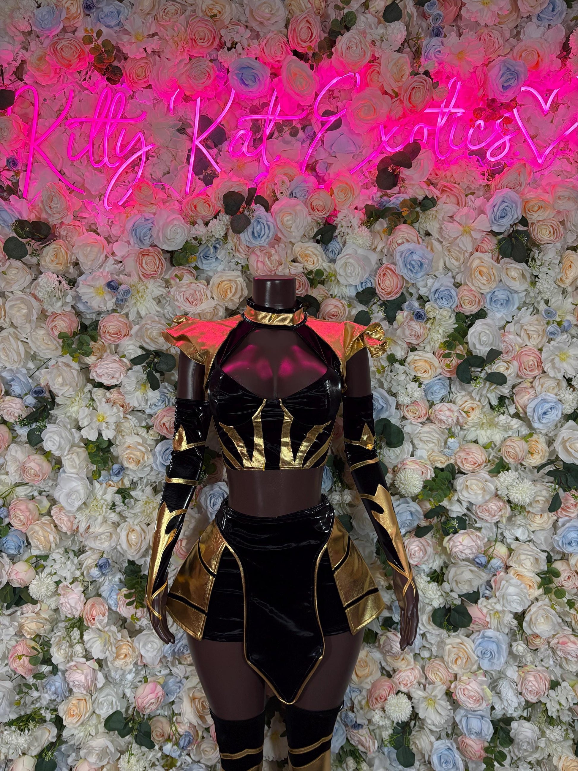 Women’s bottlegirl costume: black bodysuit with gold trim and shoulder pads