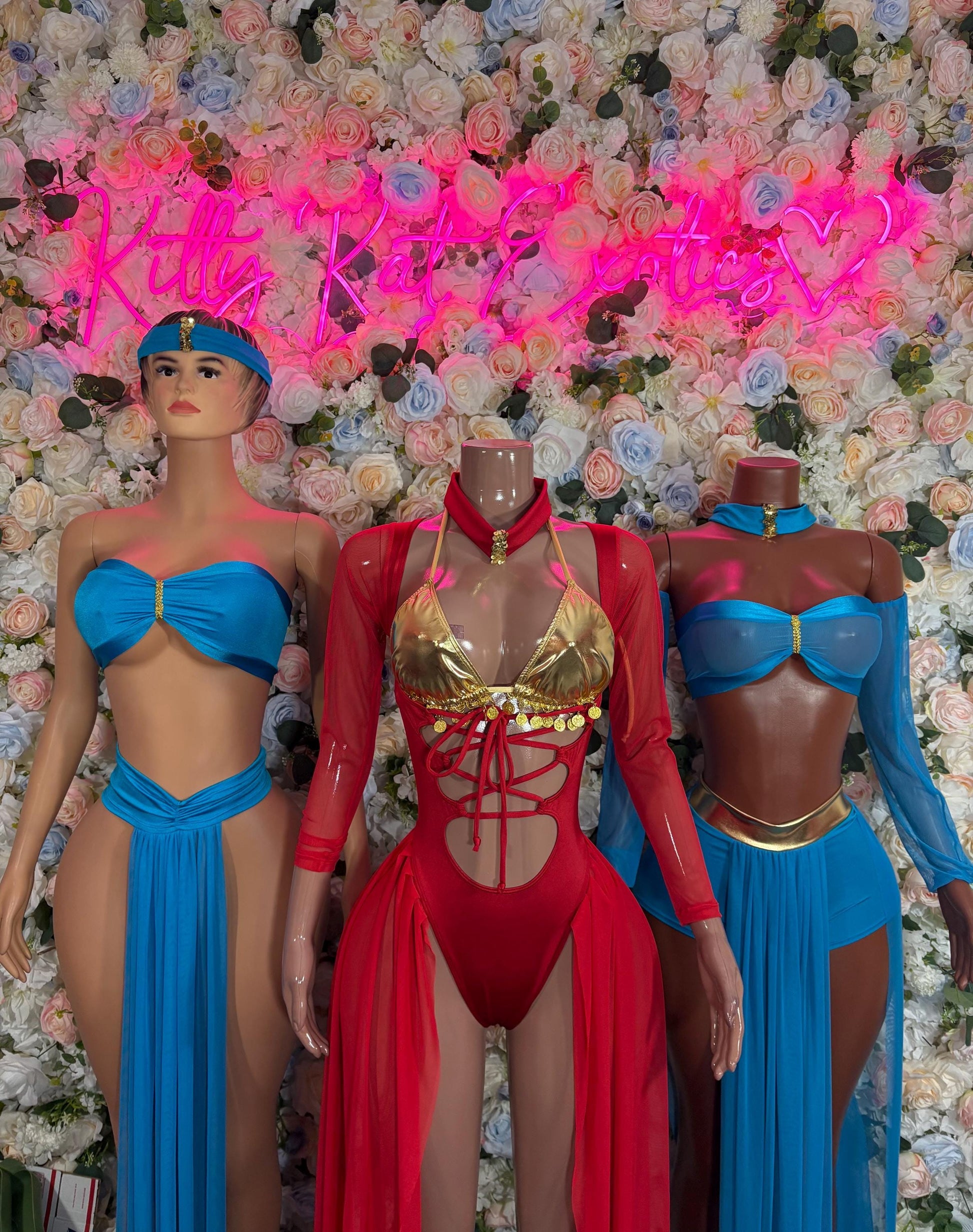 Belly dancer costume set with red bodysuit, gold trim, and two matching blue costumes