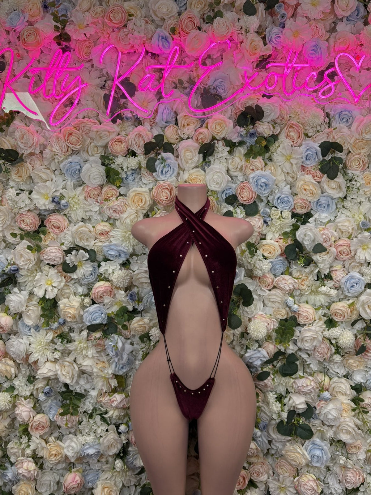 Burgundy halter cutout bodysuit with strappy chest and open sides