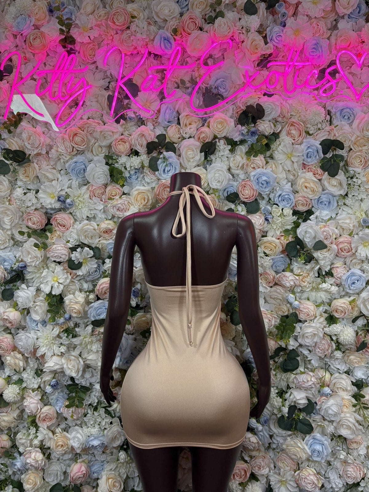 Cream bodycon mini dress with open back and tie neck