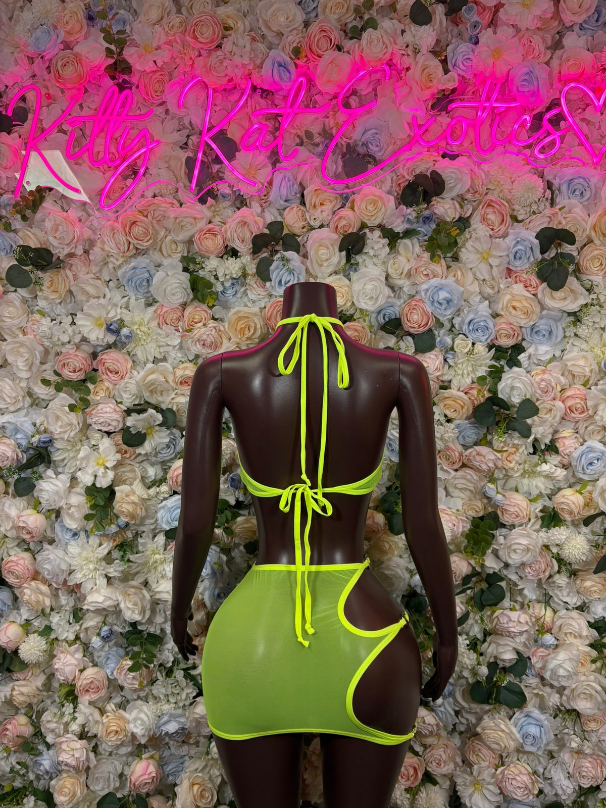 Lime green halter two-piece skirt set, open-back design with tie straps and mini skirt