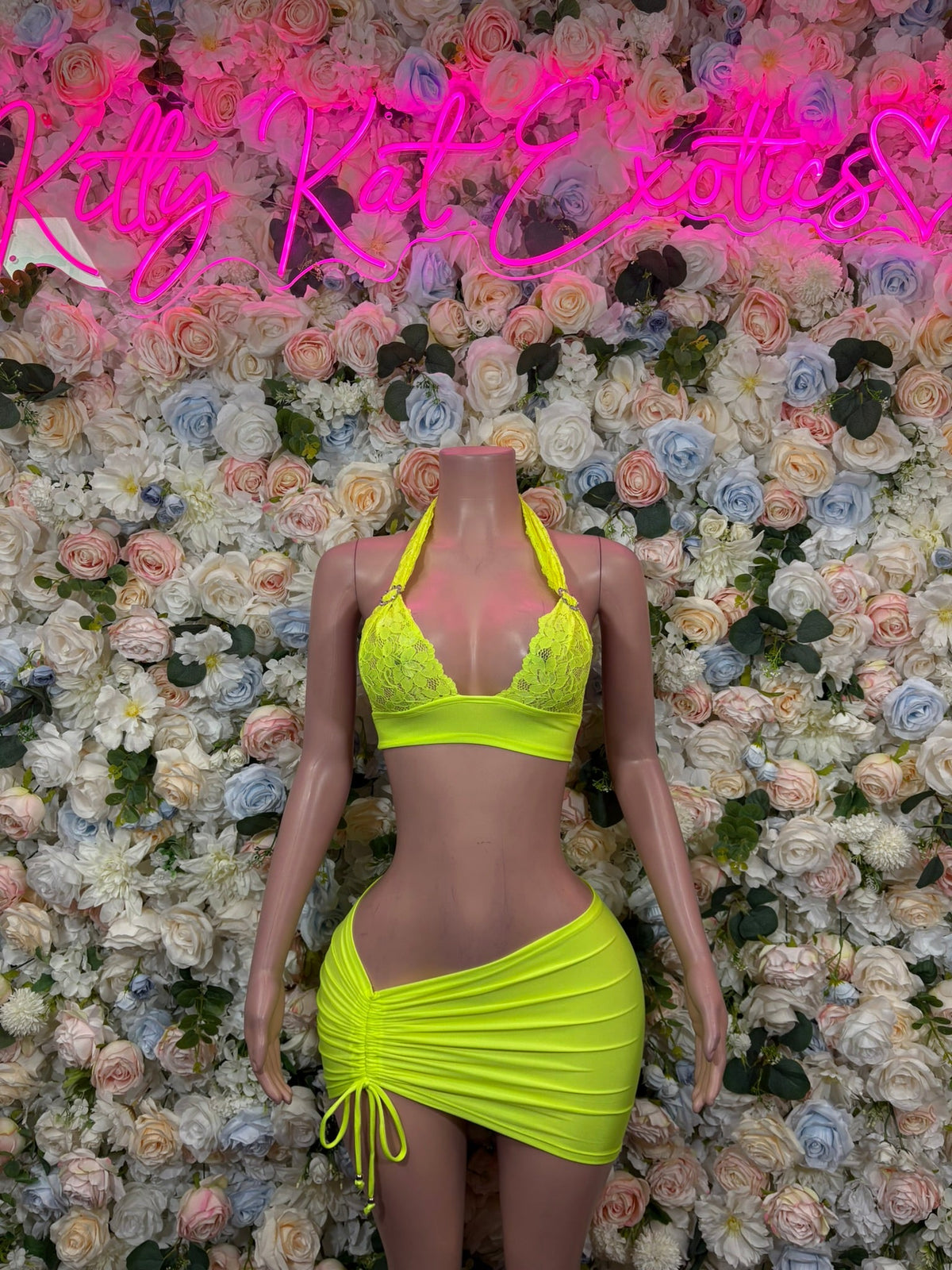 Neon yellow lace halter top and mini skirt set, with side ties and drawstring detail