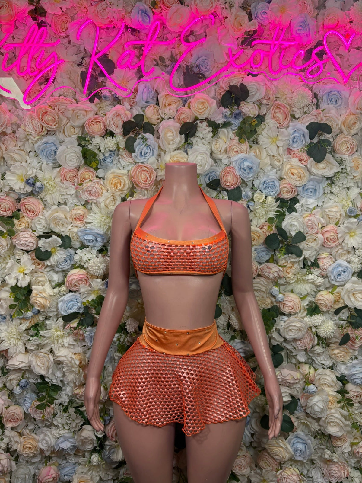 Orange fishnet halter bra top with ruched high-waist shorts, two-piece set