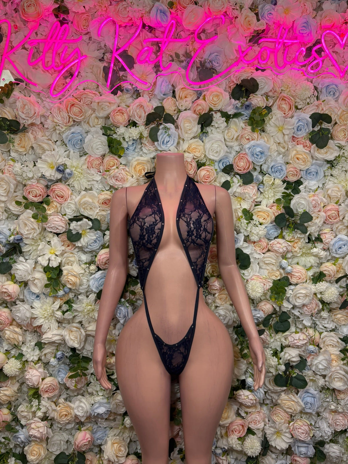 Navy floral lace plunge bodysuit with deep V front and thin straps, thong bottom