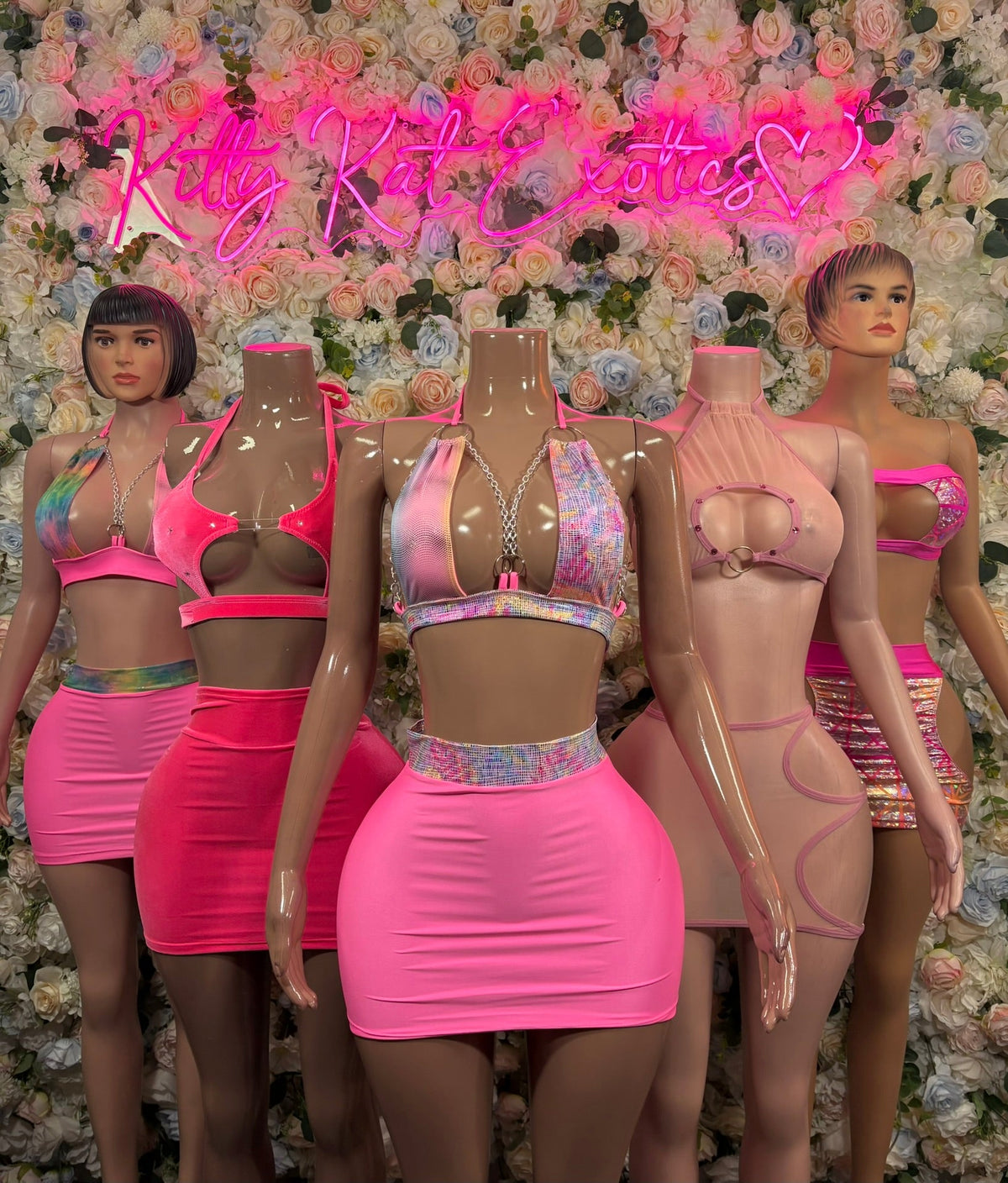 Blush pink halter top and mini skirt set on mannequins, tie-detail
