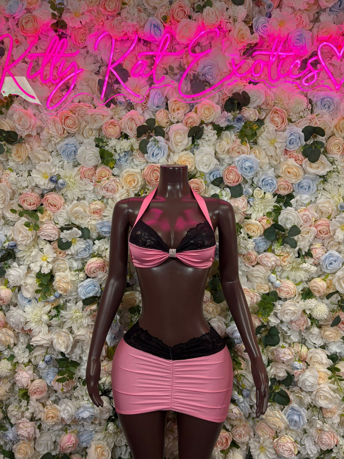 Dancewear set: black triangle bra with pink trim, ruched pink mini skirt with side drape
