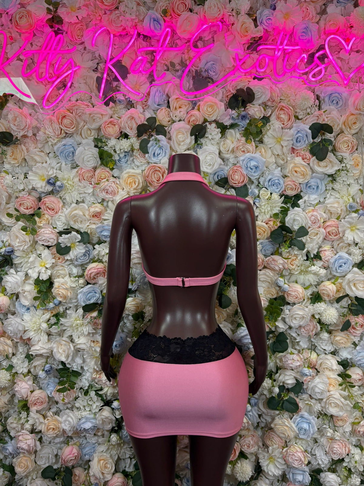Dancewear set: backless pink triangle top with black support, smooth pink mini skirt