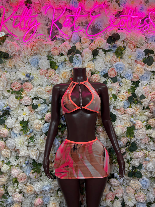 Coral strappy halter top with chain detail and printed mesh mini skirt set on mannequin