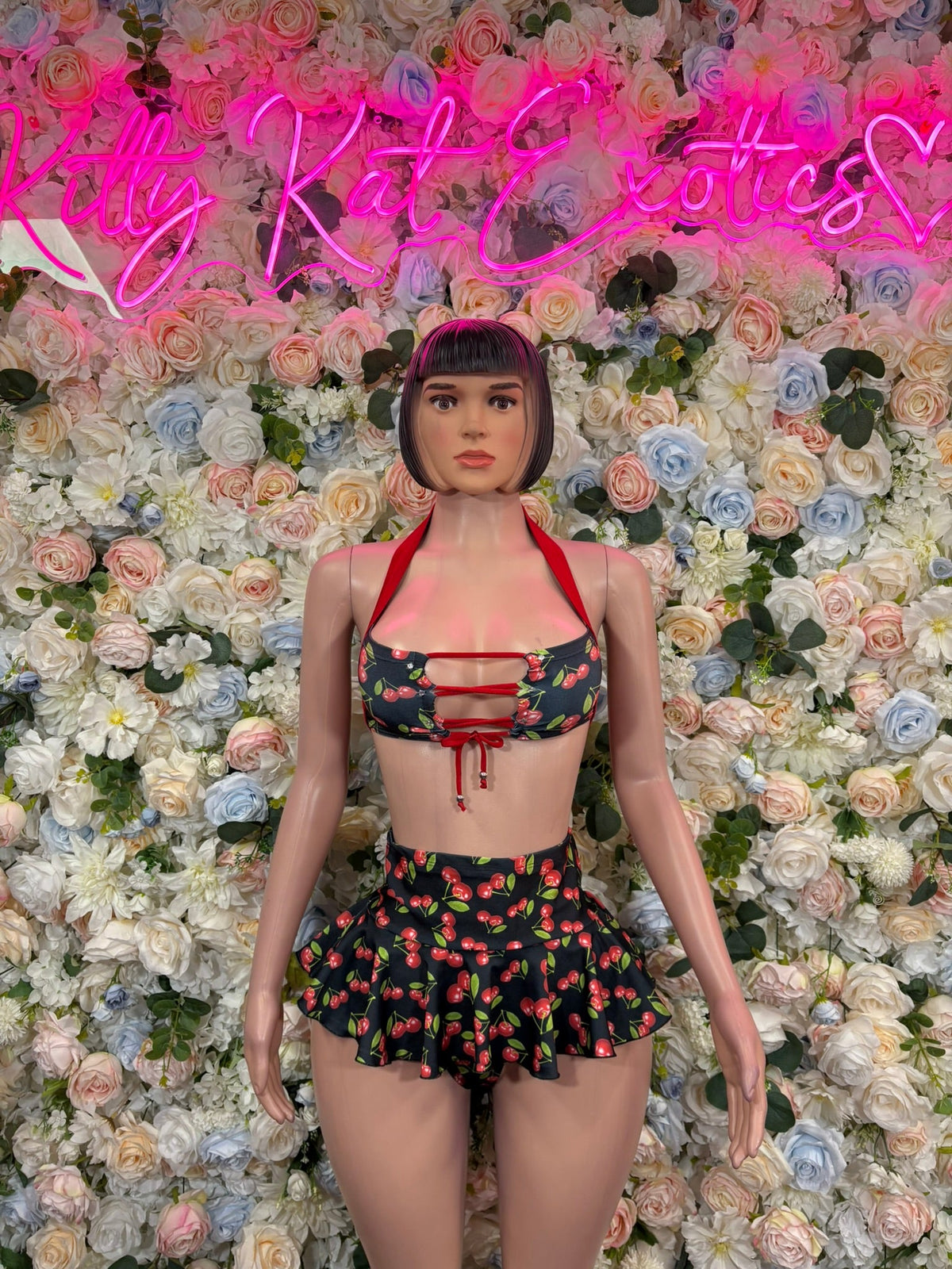 Black and red cherry-print bandeau top and mini skirt set, front view