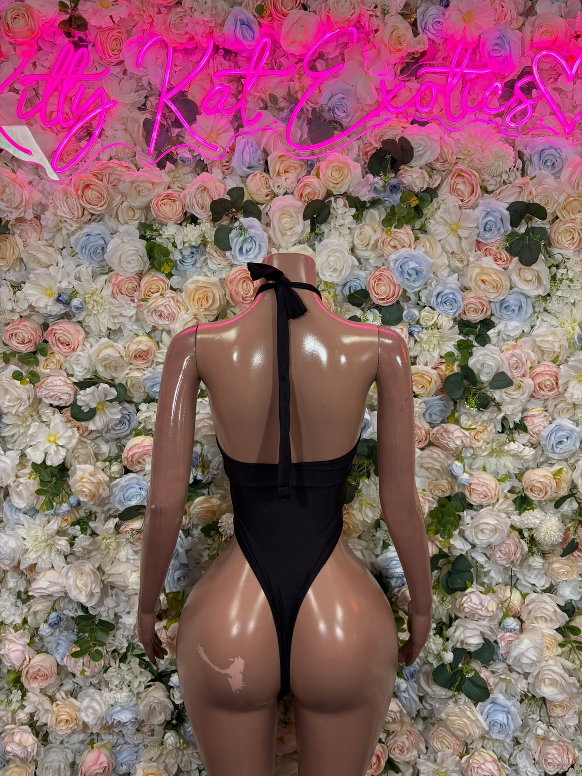 Black high-neck cutout bodysuit, back view