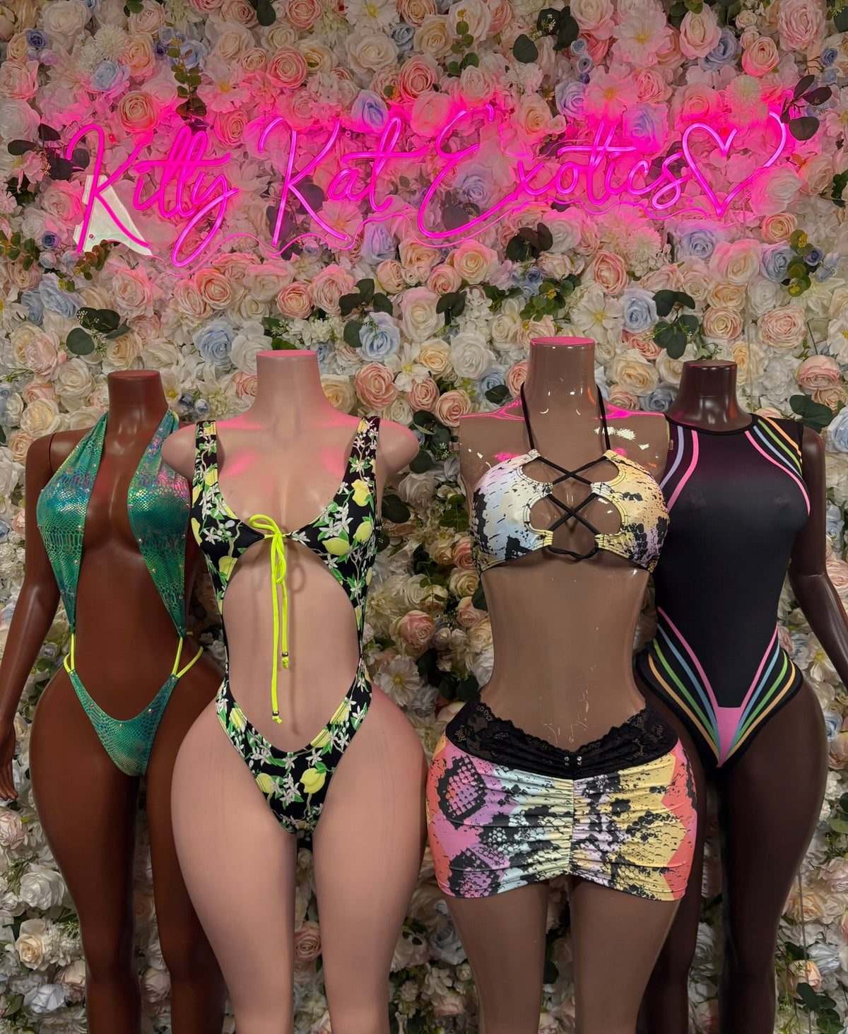 Snake-print halter top and lace-trim mini skirt set, multiple color mannequins.
