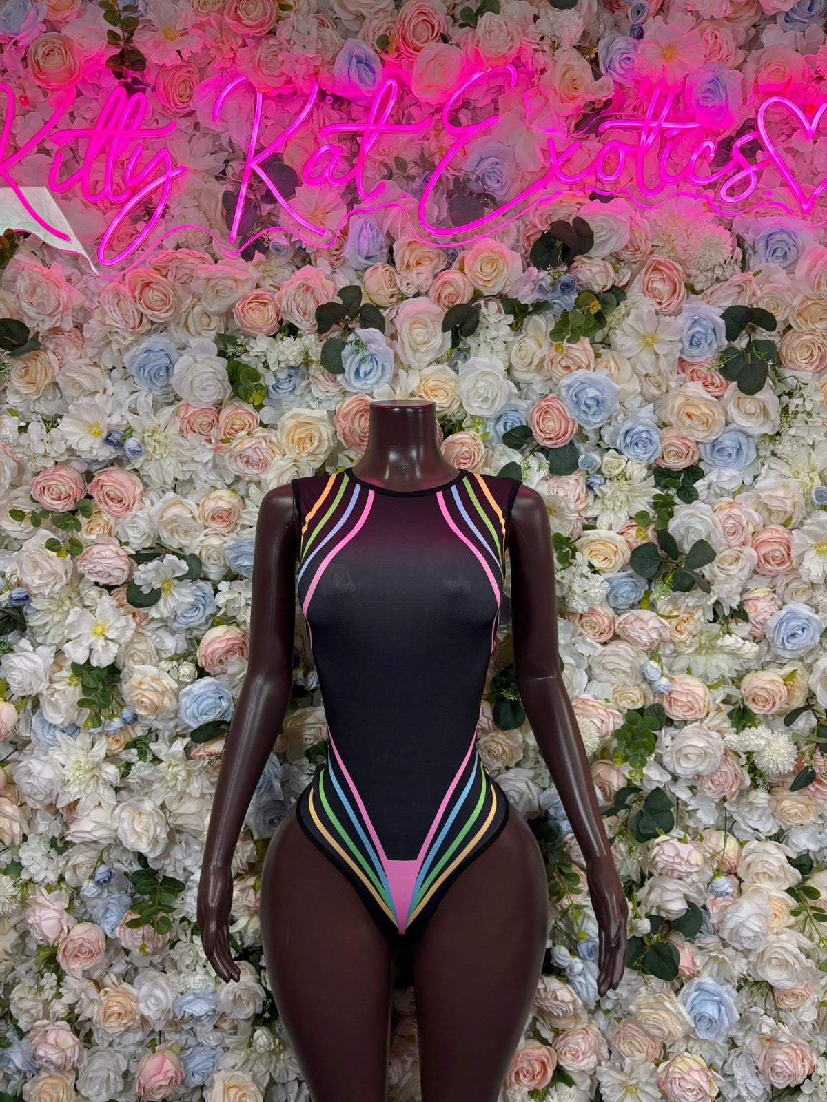 Black high-neck bodysuit with multicolor striped trim, high-cut back view