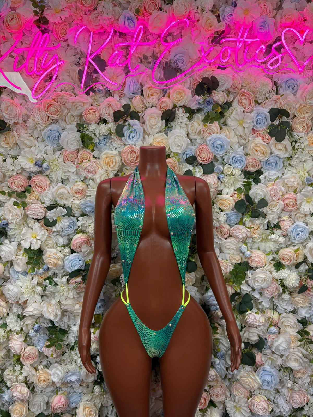 Turquoise plunge slingshot bodysuit with yellow trim and tie side straps