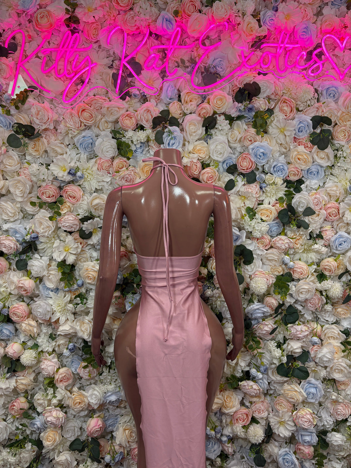Dusty pink halter maxi dress with open back keyhole detail and high-slit skirt