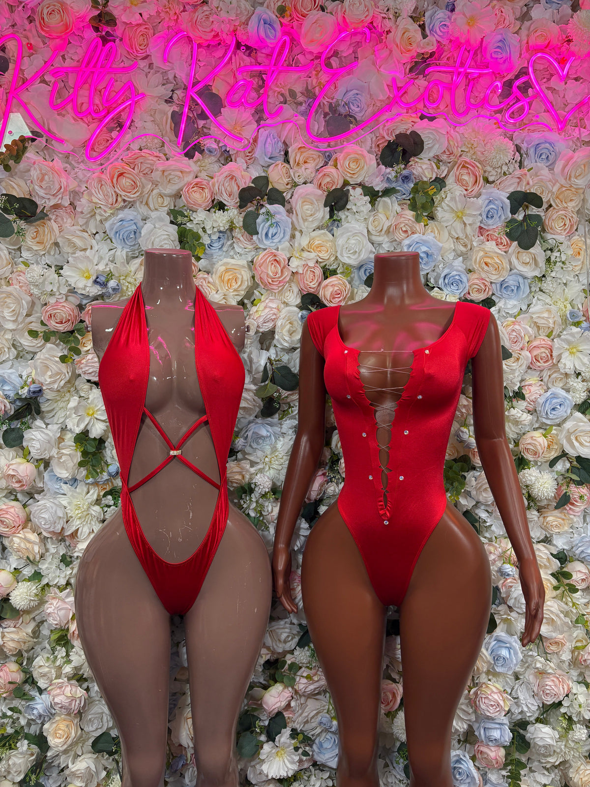 Red plunge bodysuit with snap-button front and lace-up back straps