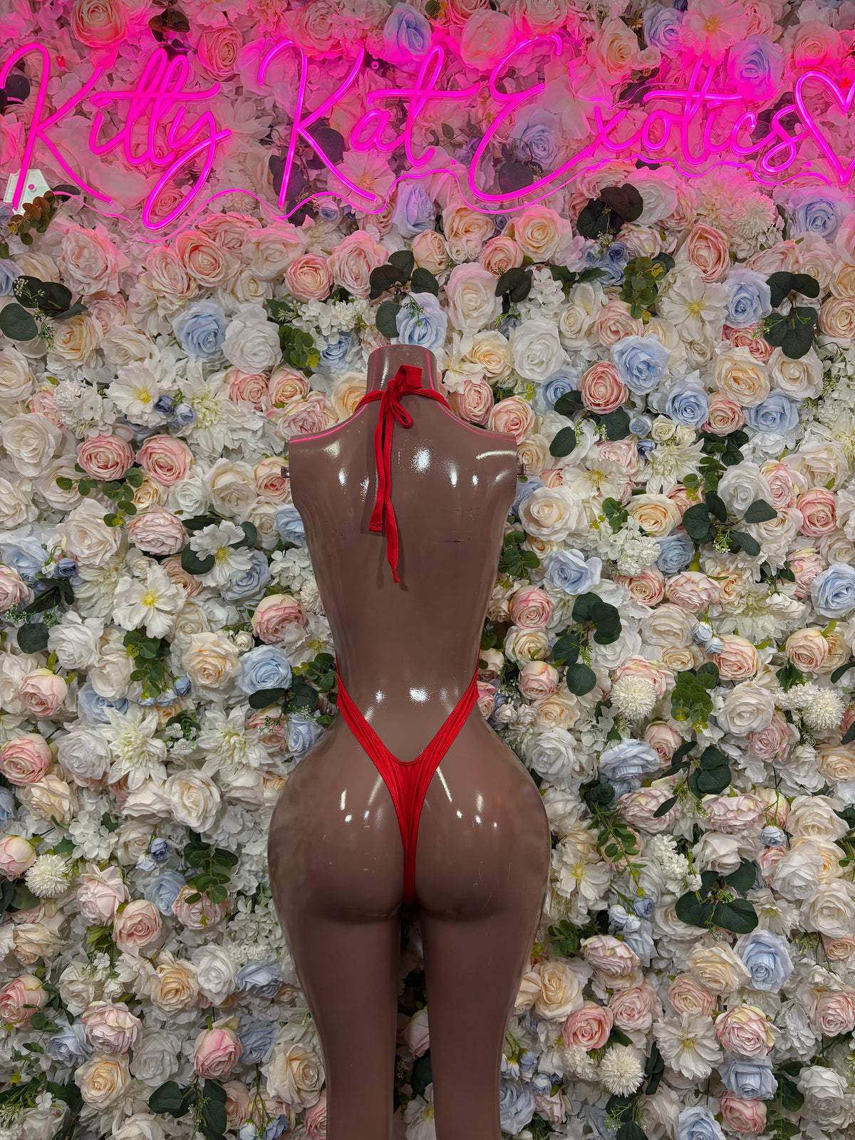 Red plunge lace-up bodysuit with open back and V-cut sheer thong bottom
