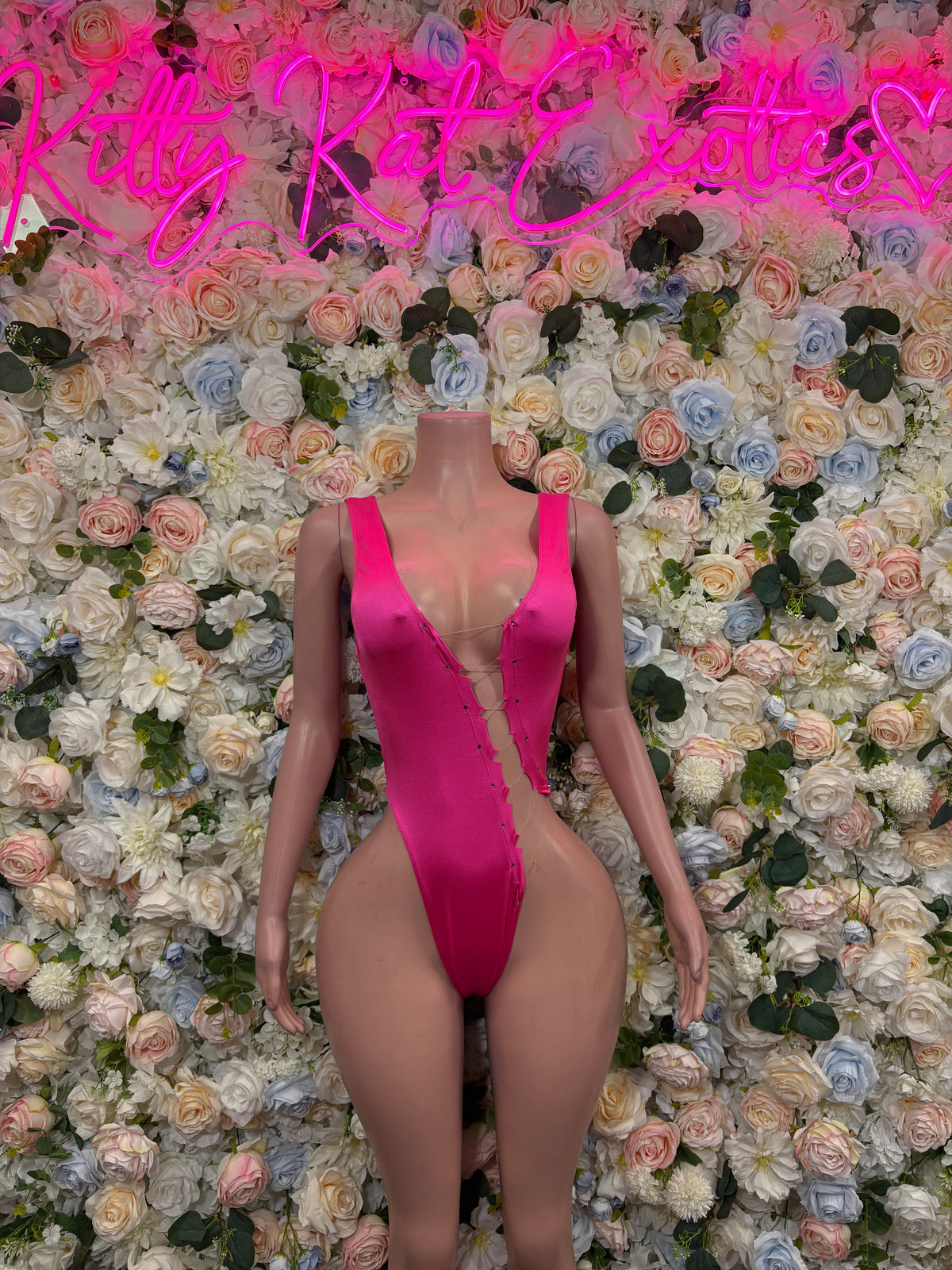 Hot pink plunge bodysuit with deep V neckline and thin shoulder straps
