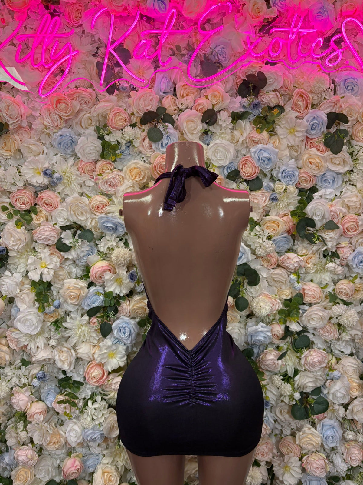 Plunge halter mini dress with neck tie, open-back dark satin sheen.